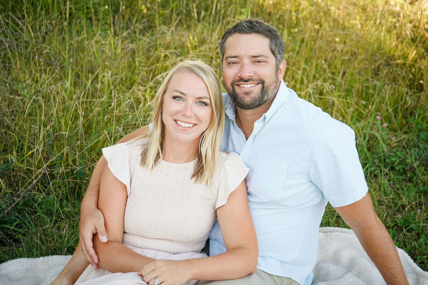 Happy couple sharing tender moments during golden hour photography session.