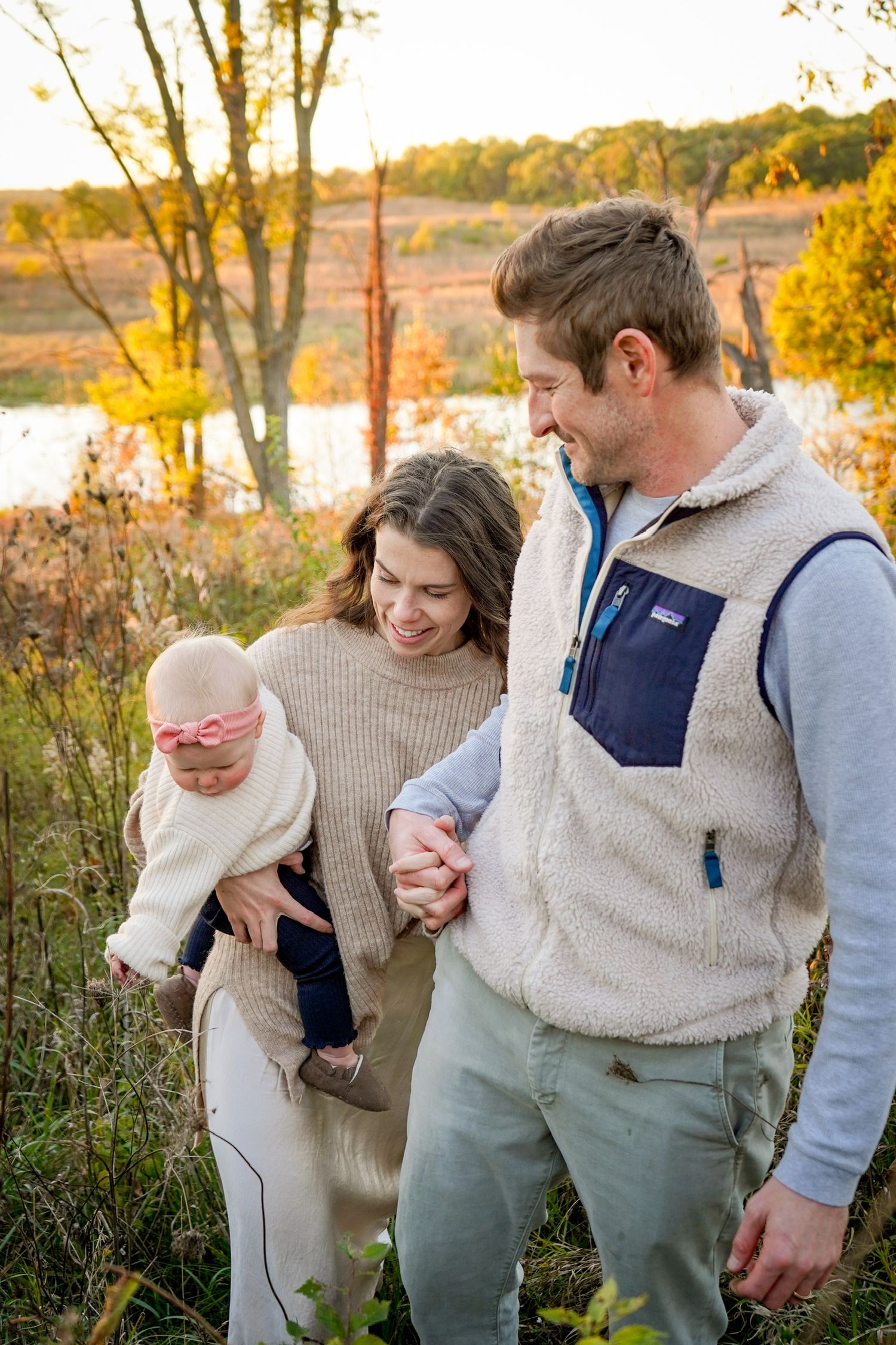 Casual family lifestyle photos showing playful moments in autumn field setting.