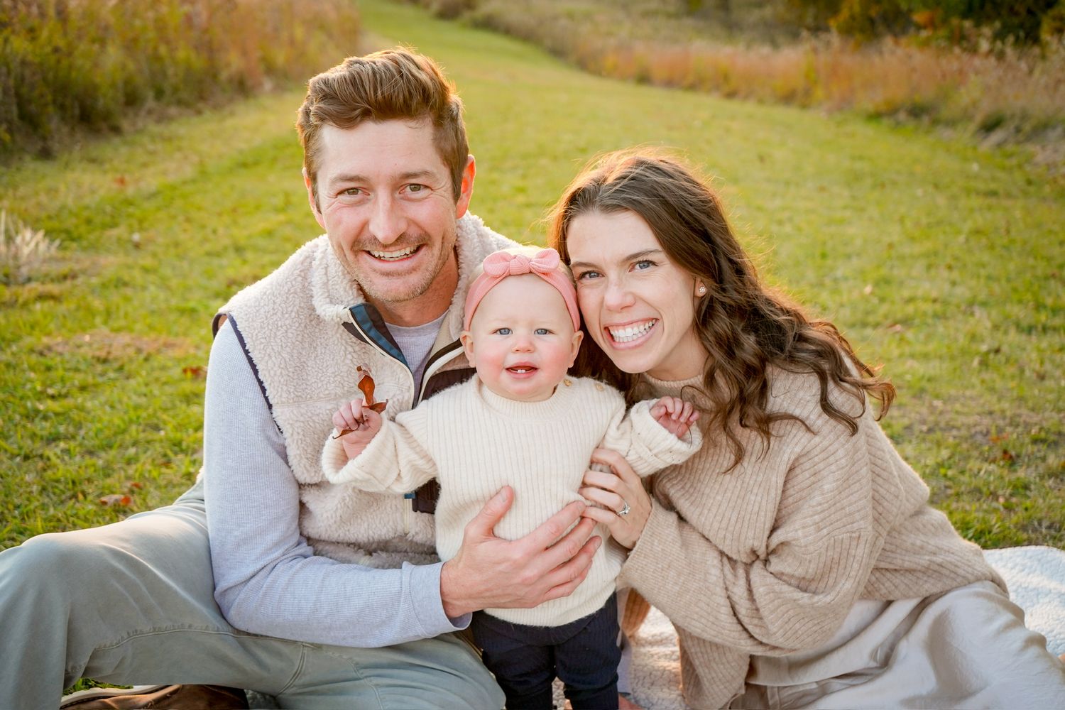 Candid family photos taken at sunset showing playful interactions outdoors.