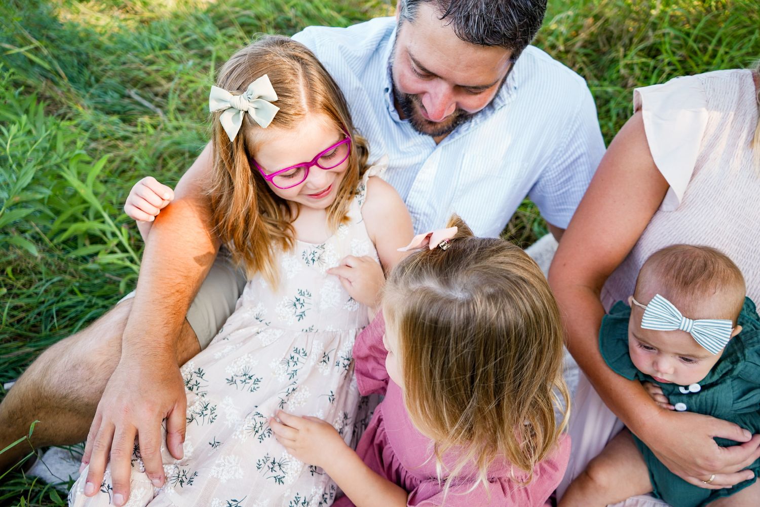 Family gathering captured in casual outdoor setting with natural lighting.