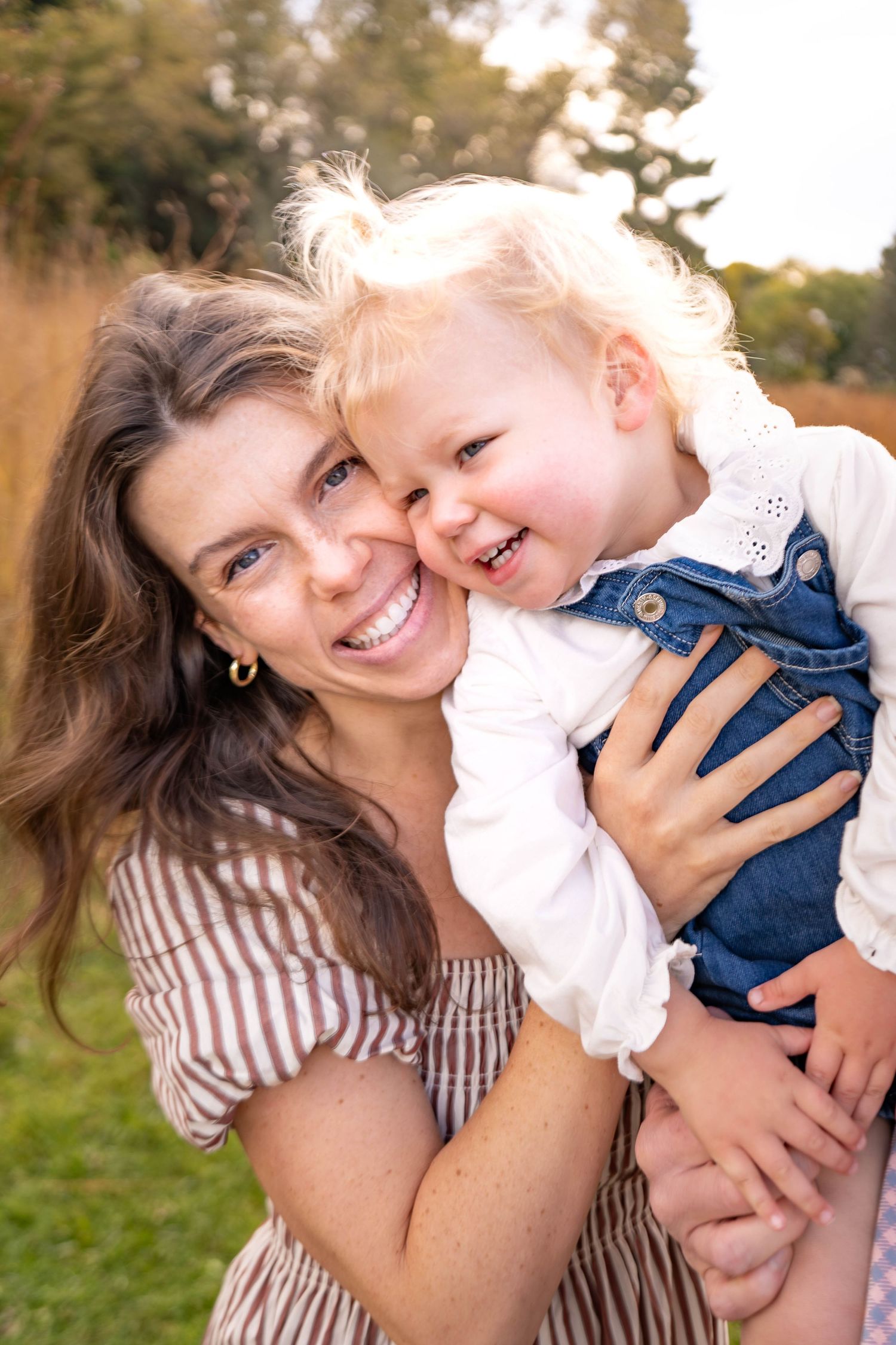A series of candid outdoor photos showing joyful moments between a parent and child playing together in natural light.