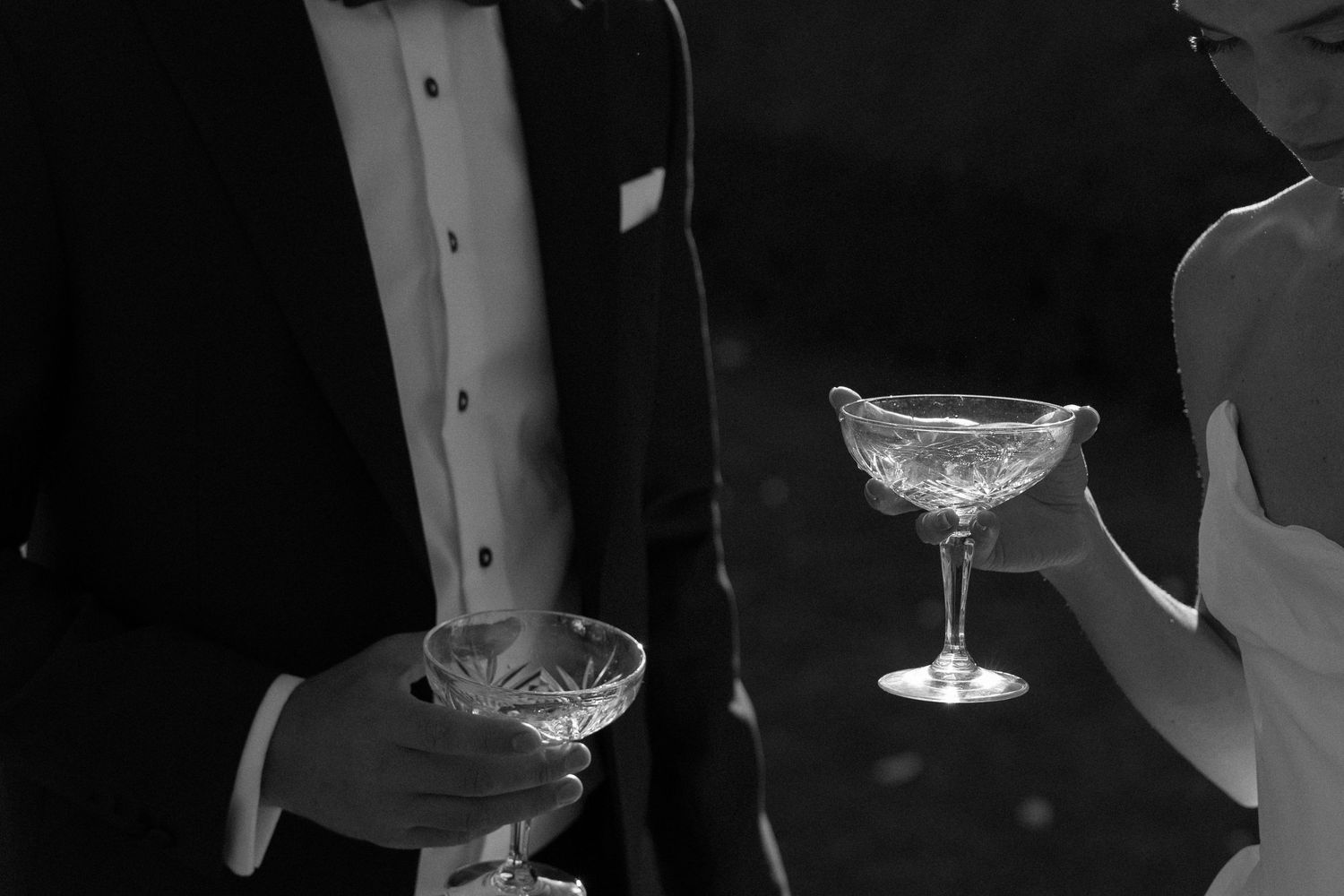 Champagne glasses and drinks being served at an elegant event.