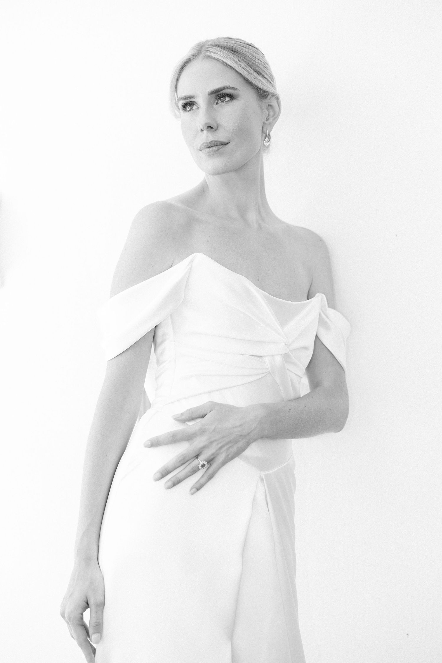 High-key portrait series in white featuring elegant minimal fashion poses.