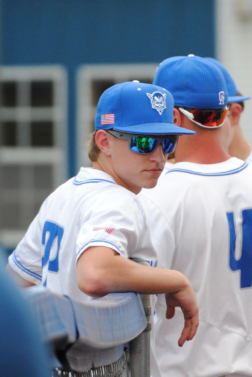 High school baseball player in sunglasses