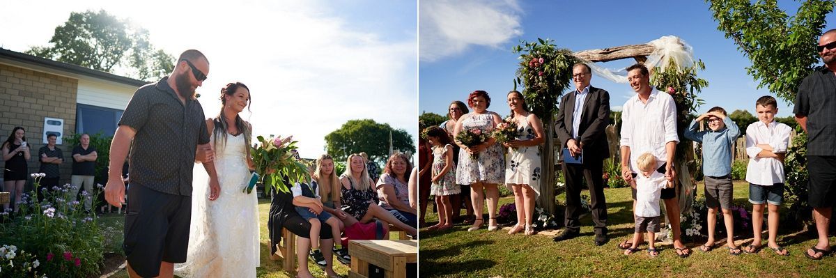 Outdoor wedding ceremony with bride and groom walking among guests, and wedding party standing near a floral arch.