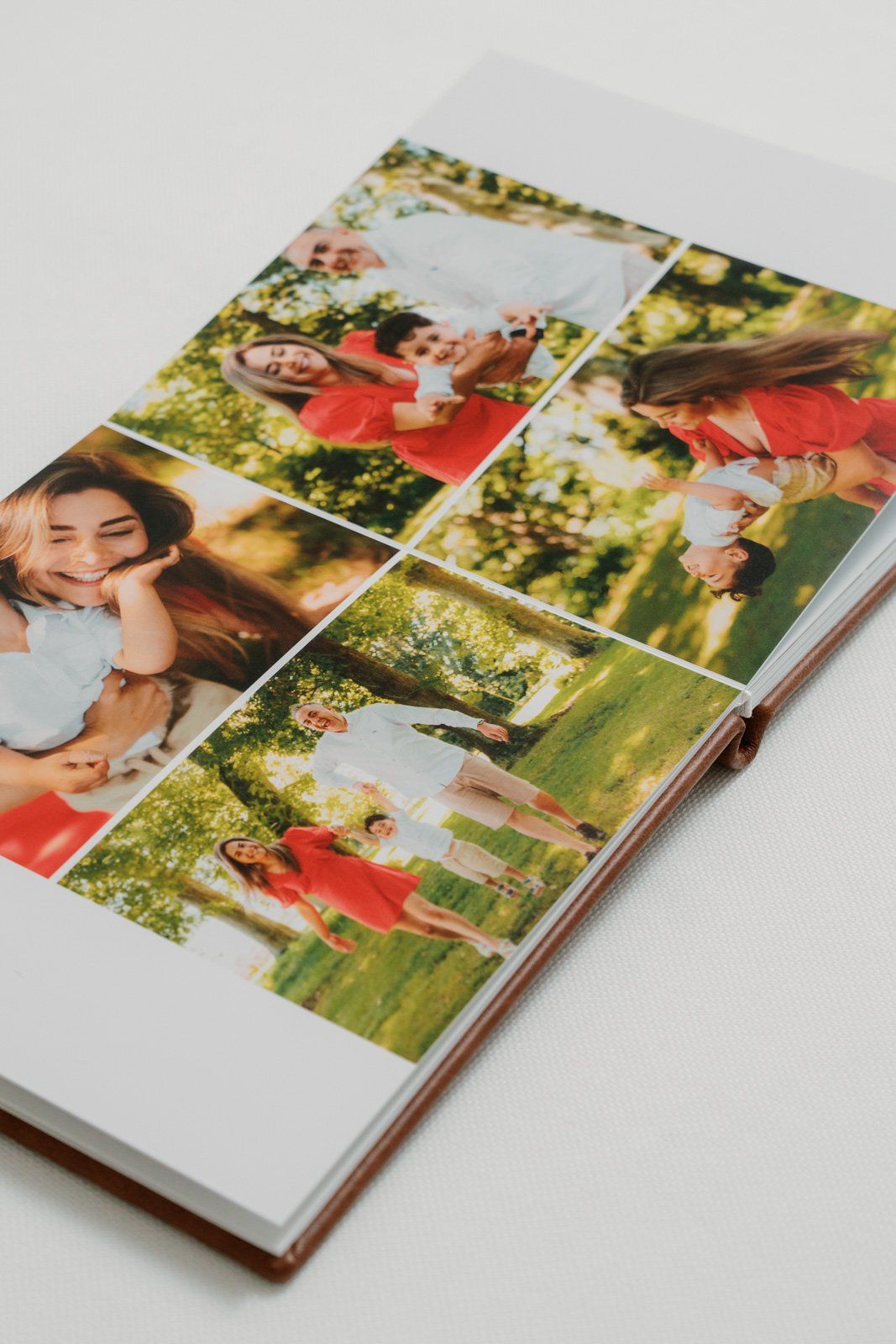 A photo book with a collage cover featuring two young women posing outdoors in a sunny green park setting.