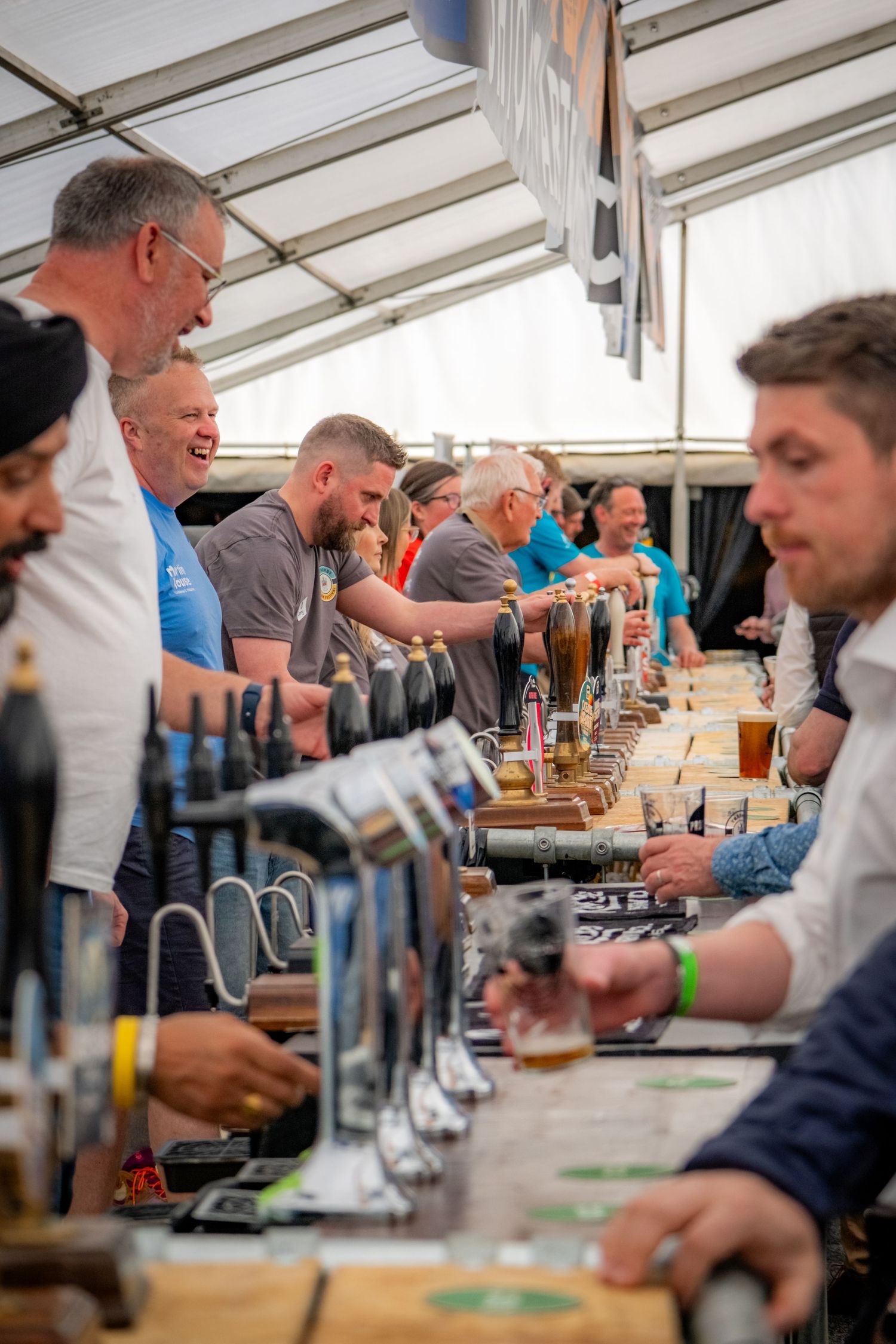 Crowd enjoying live music, beer and sunshine at Yorkshire beer festival