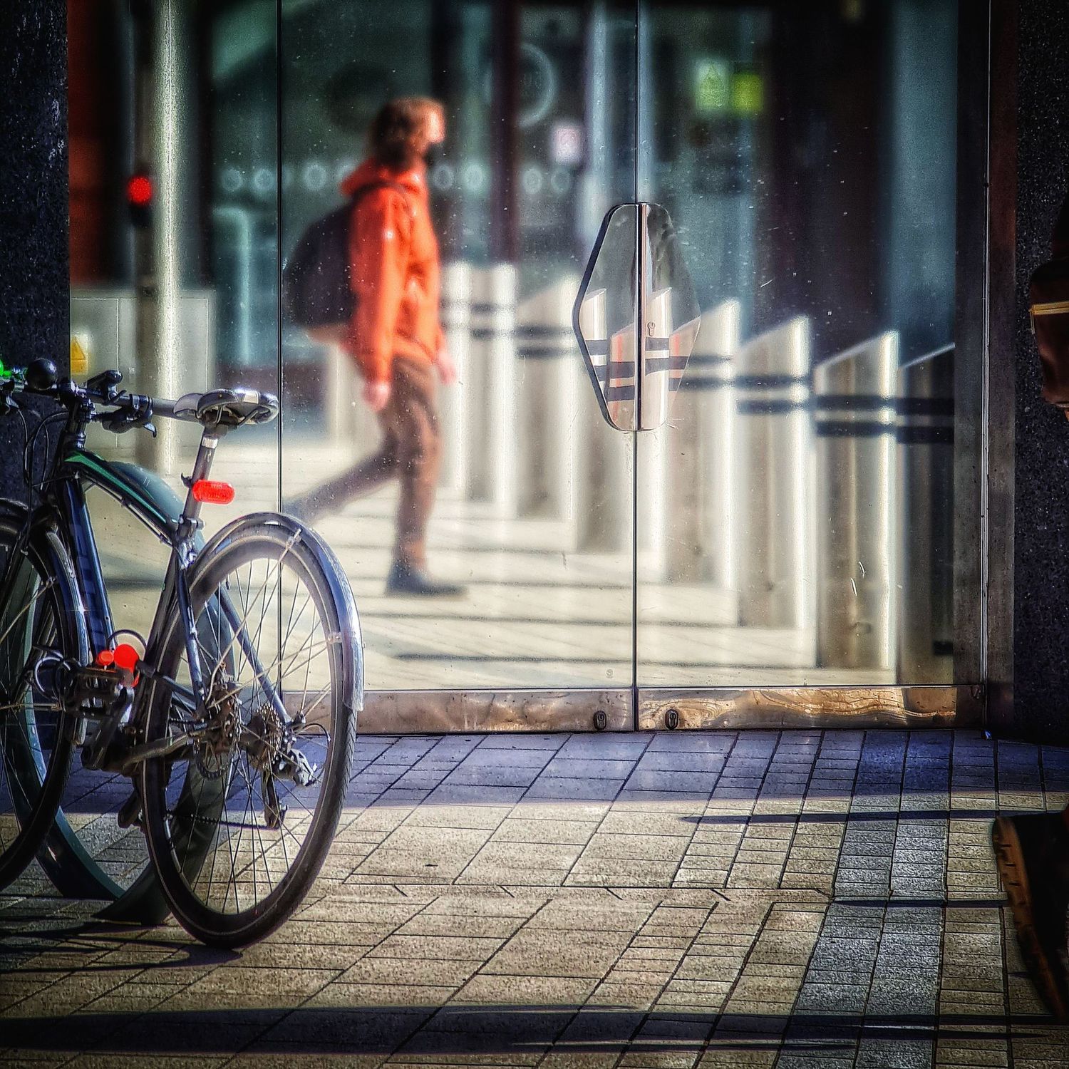 Image of a bicycle reflected in a steel door