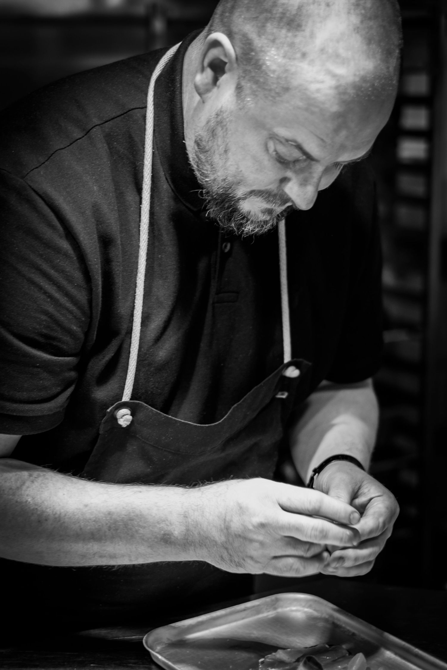 Candid portrait of a talented Yorkshire chef at work in the kitchen, photographed for Simon Robertson’s Shooting Chefs project.