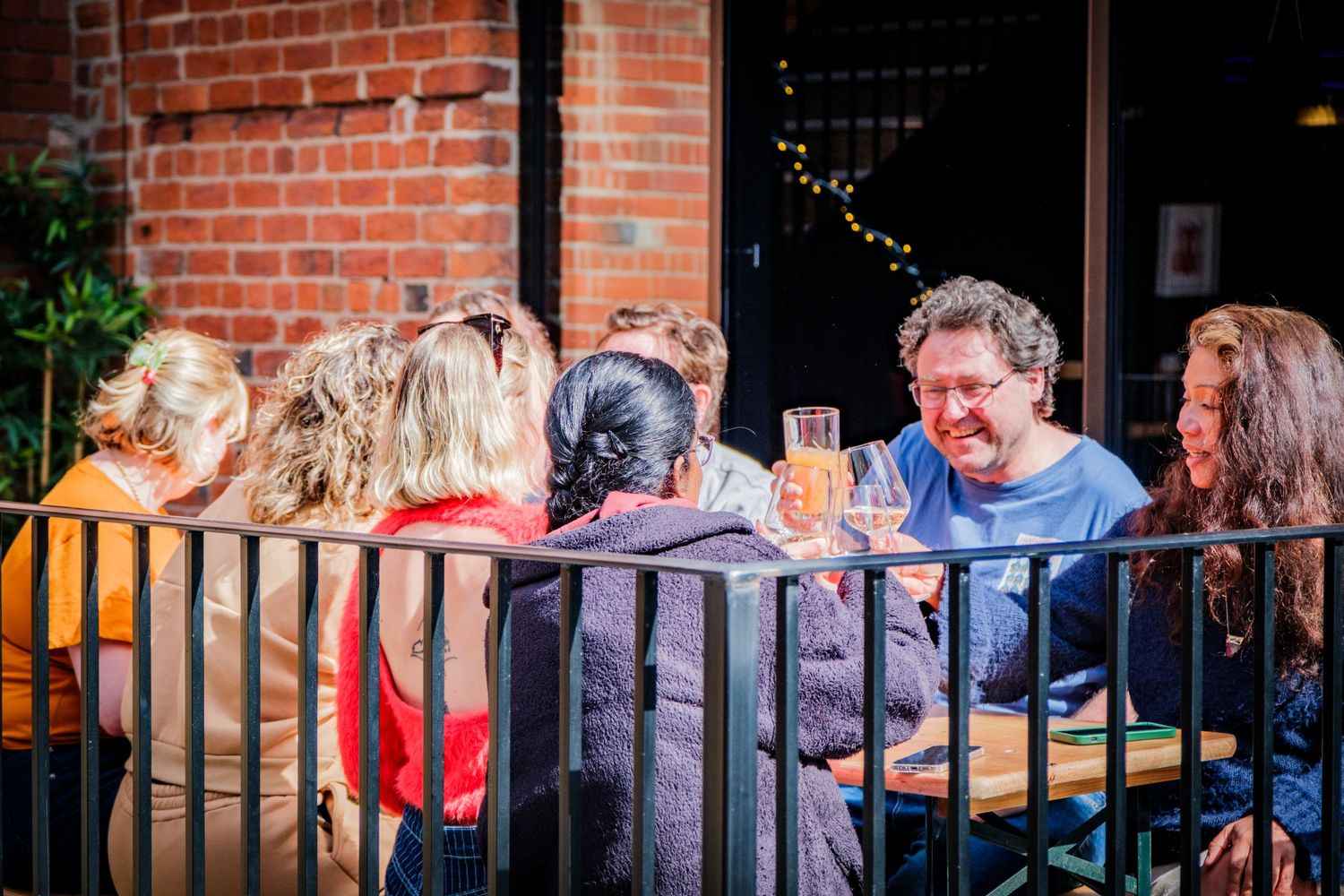 Group photograph of individuals enjoying a launch event at a restaurant in Sheffield