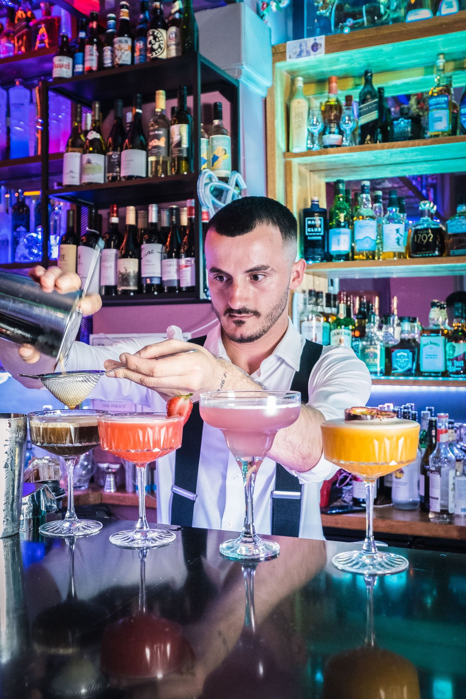 Barman pouring a cocktail in a busy bar in Harrogate as part of the launch celebrations