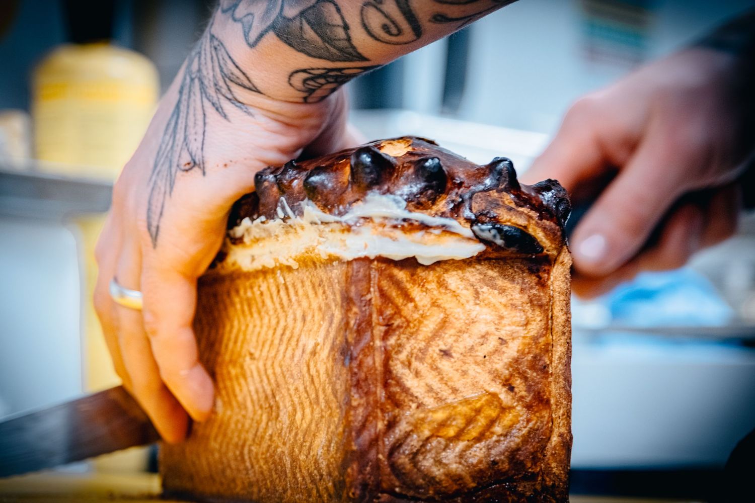 Freshly baked steak and ale pie with a crispy crust being sliced ready for service