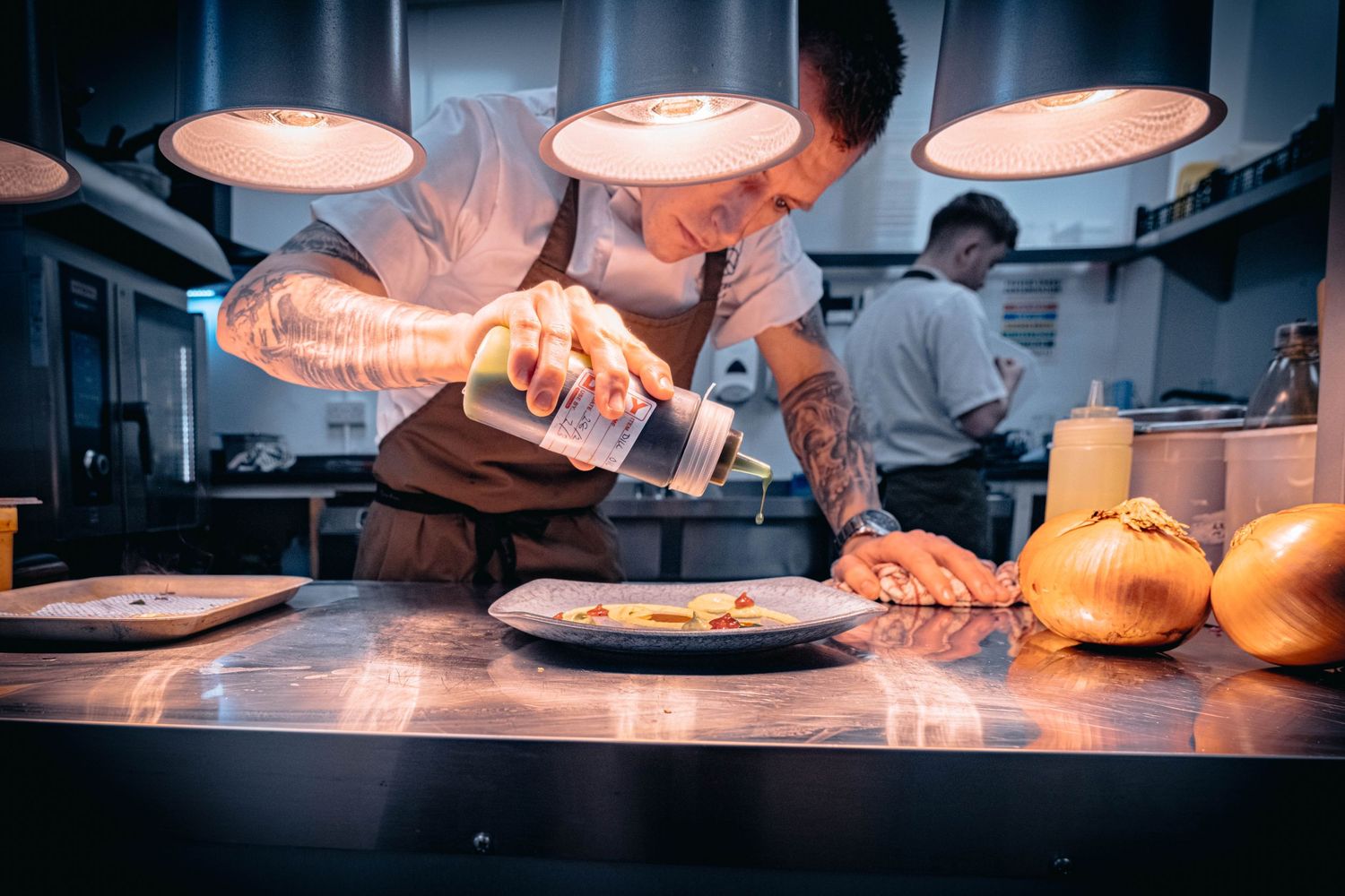 Candid portrait of a Yorkshire chef at work in the kitchen, photographed for Simon Robertson’s Shooting Chefs project.