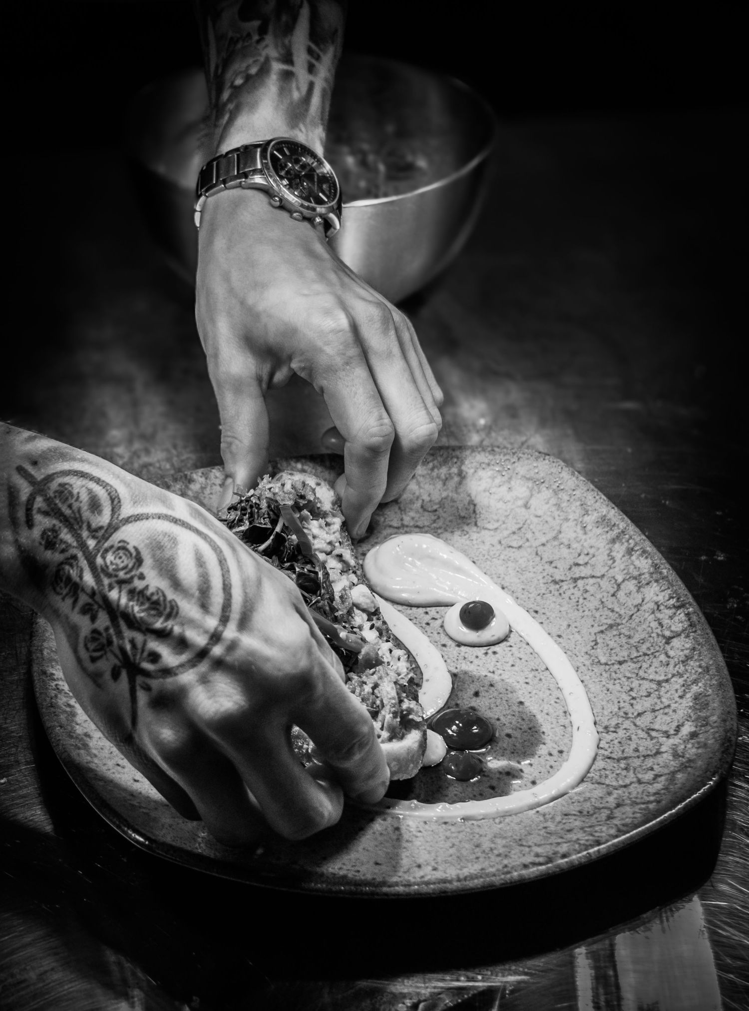 Food photograph of chef preparing pasta dish in Yorkshire kitchen, styled to highlight movement and detail