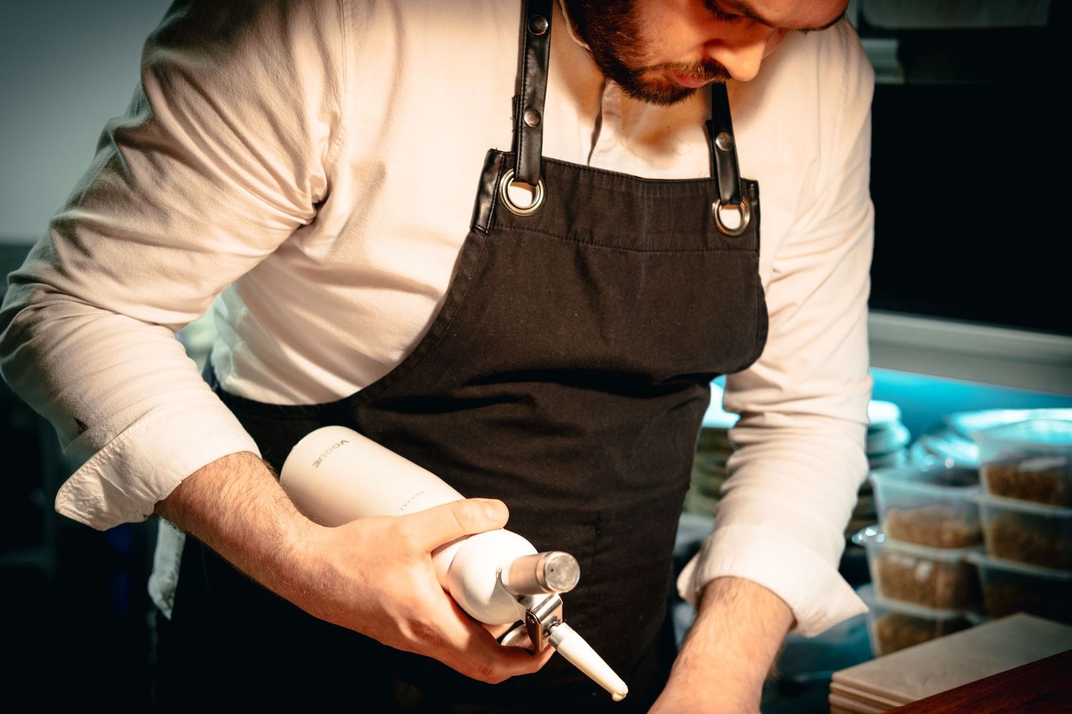A chef preparing a delicious dessert as part of Shooting Chefs by Simon Robertson
