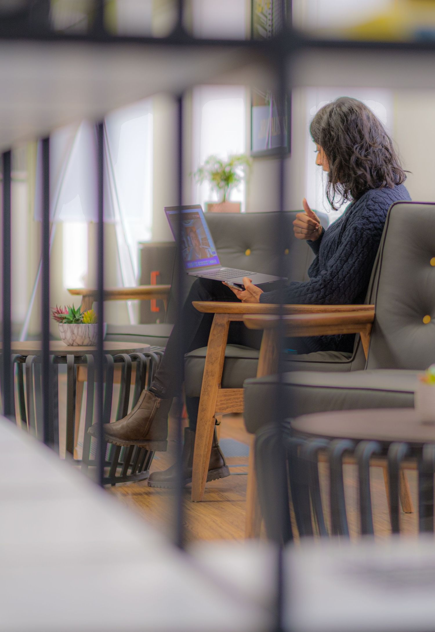 Candid shot of a business woman in a smart open plan office in Yorkshire