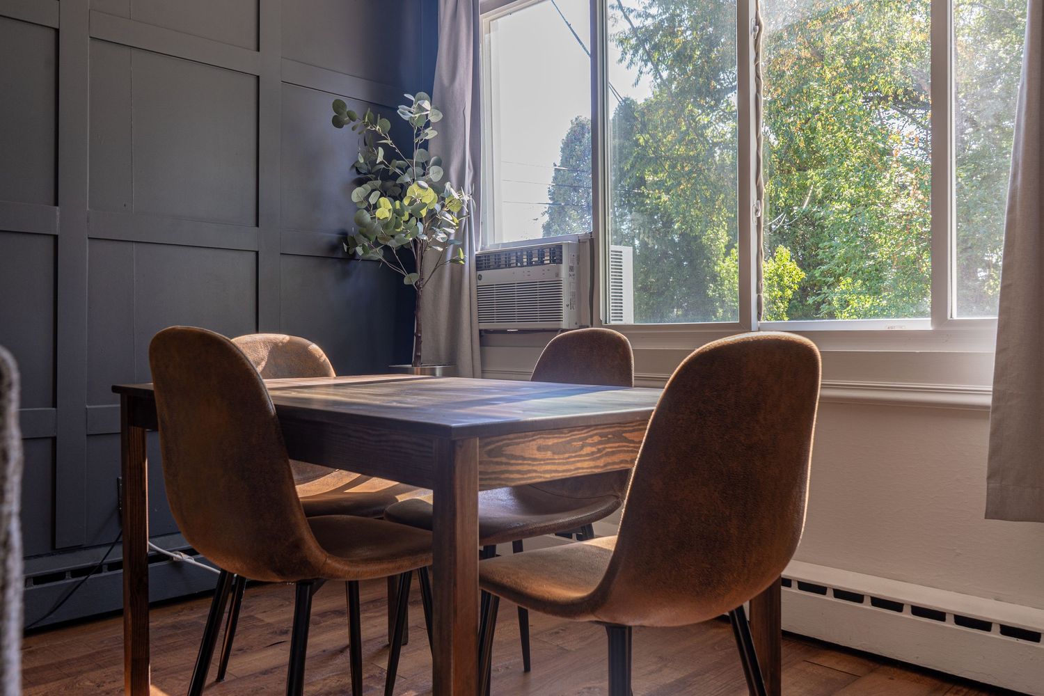 Modern dining area with large windows in a Chicago Airbnb