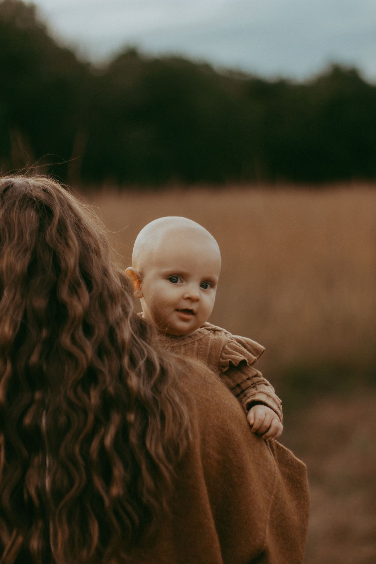 mom holding baby unique elk river, mn family session portrait photographer Photographer Photography Wedding Couples Engagement Session