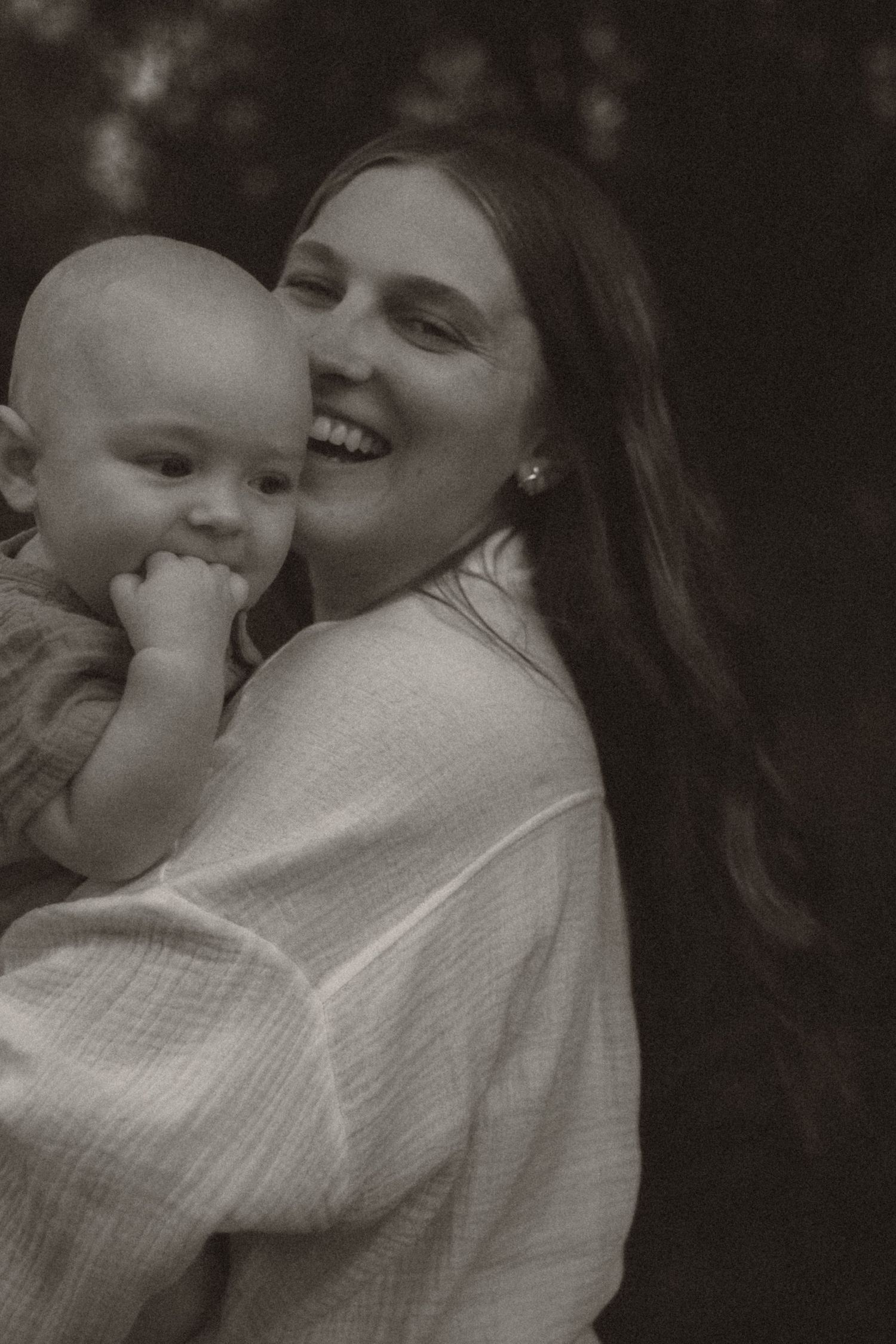 A moody emotional image of happiness in motherhood, a mother and baby in black and white, retro nostalgic Elk River, Minnesota MN Unique