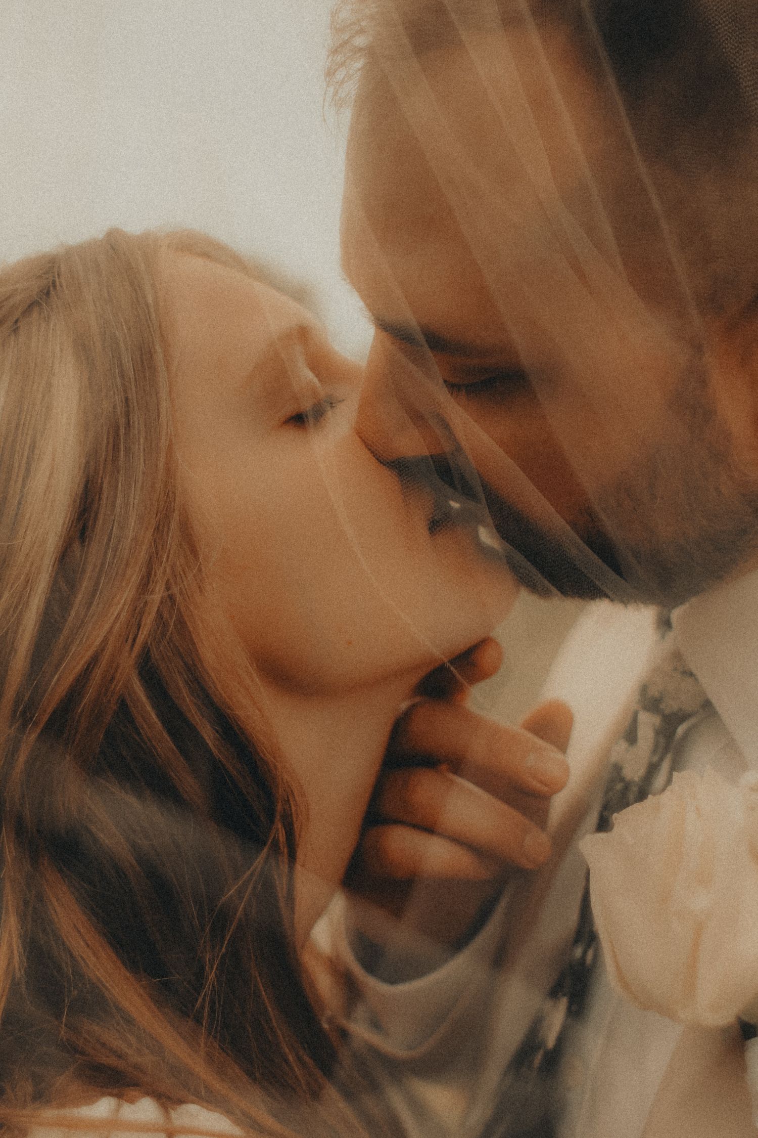 A couple shot through veil, warm nostalgic moody light wedding in Milaca, Minnesota  Elk River, MN Photographer Photography Unique Couples