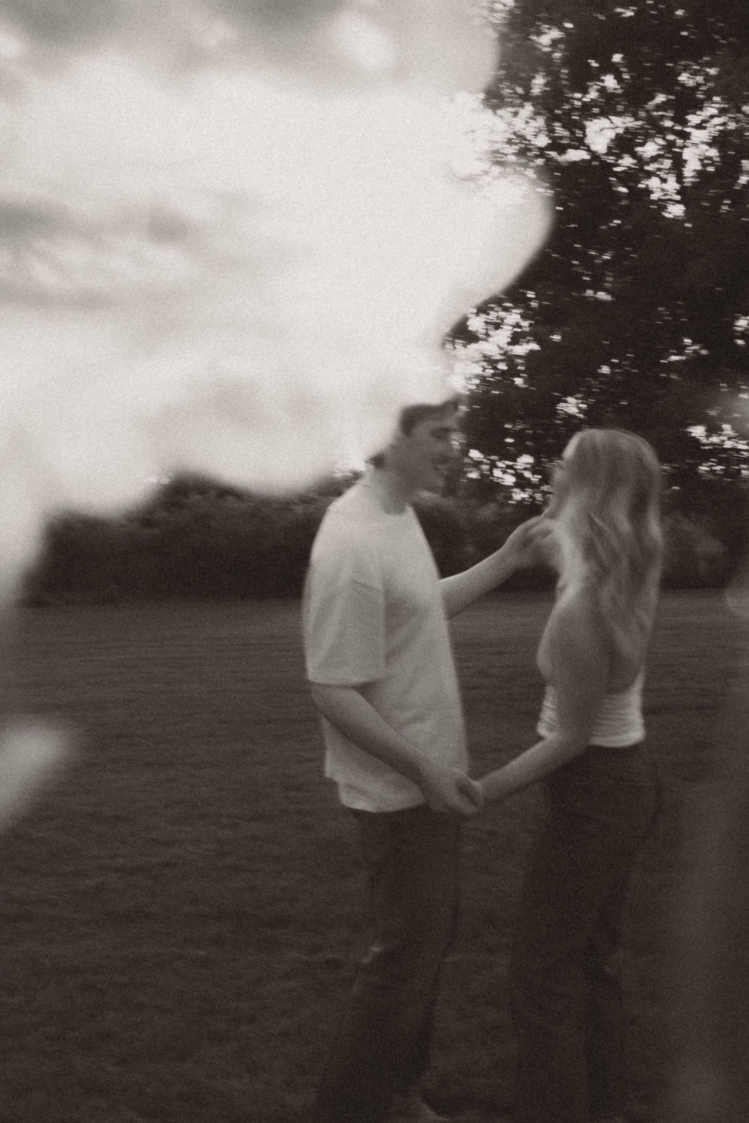 A couple, warm nostalgic moody light engagement session in Milaca, Minnesota Black and white  Elk River, MN Photographer Photography Wedding