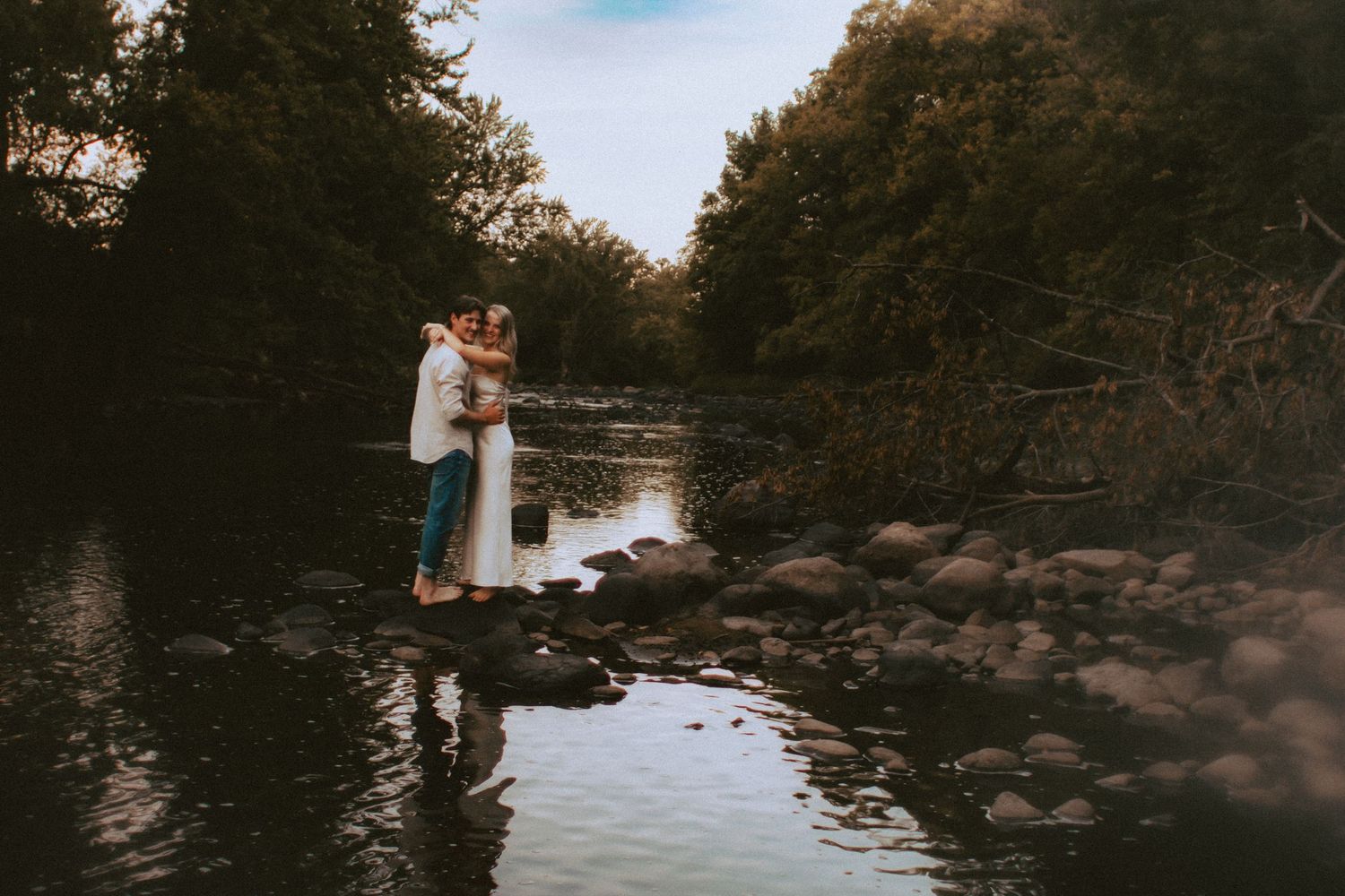 A couple by Rum River, warm nostalgic light engagement session in Milaca, Minnesota  Elk River, MN Photographer Photography Wedding Unique