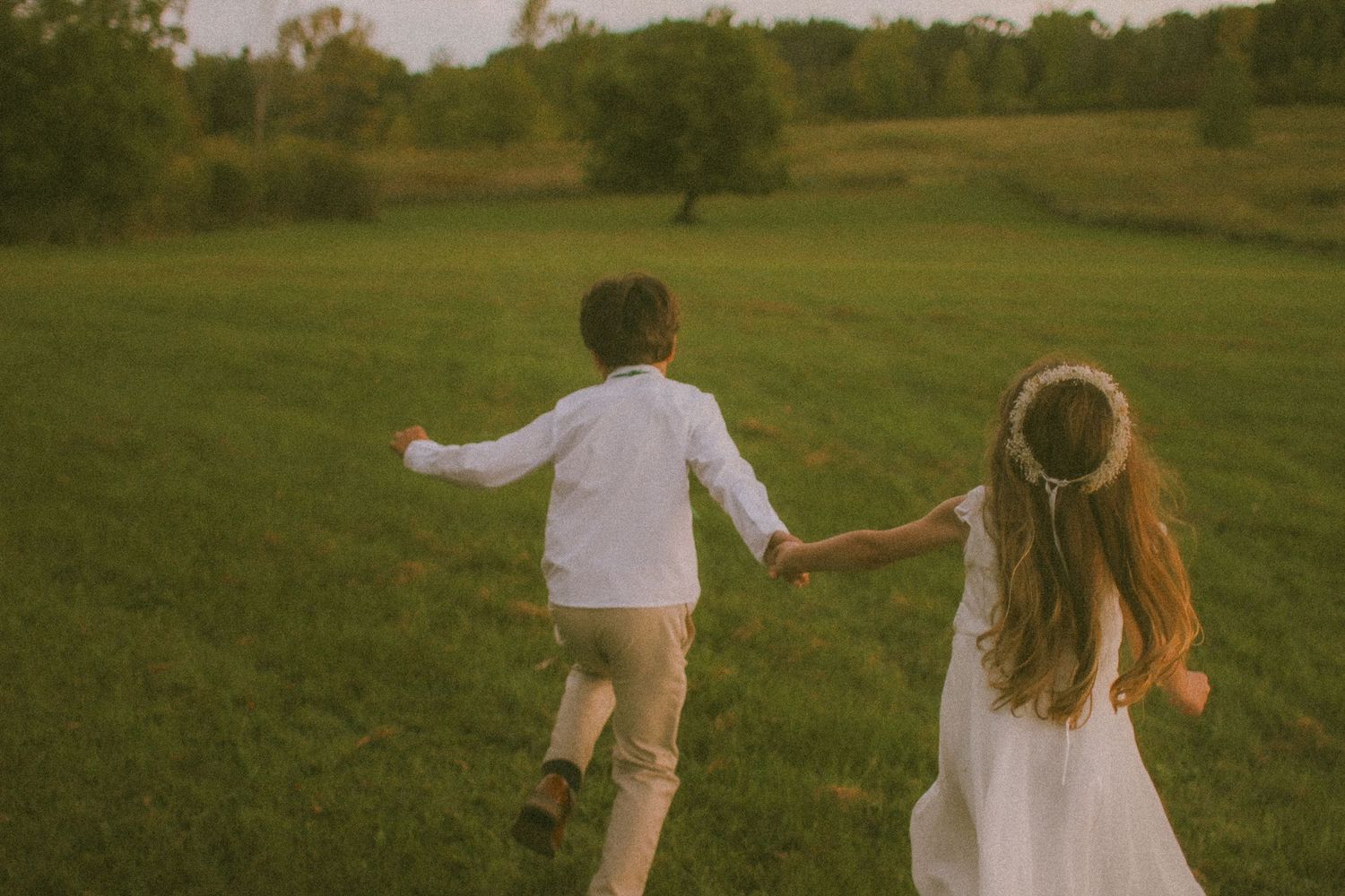 Photo of children running through field in MIlaca, MN Warm nostalgic photography Photographer Photography Wedding Couples Family Unique