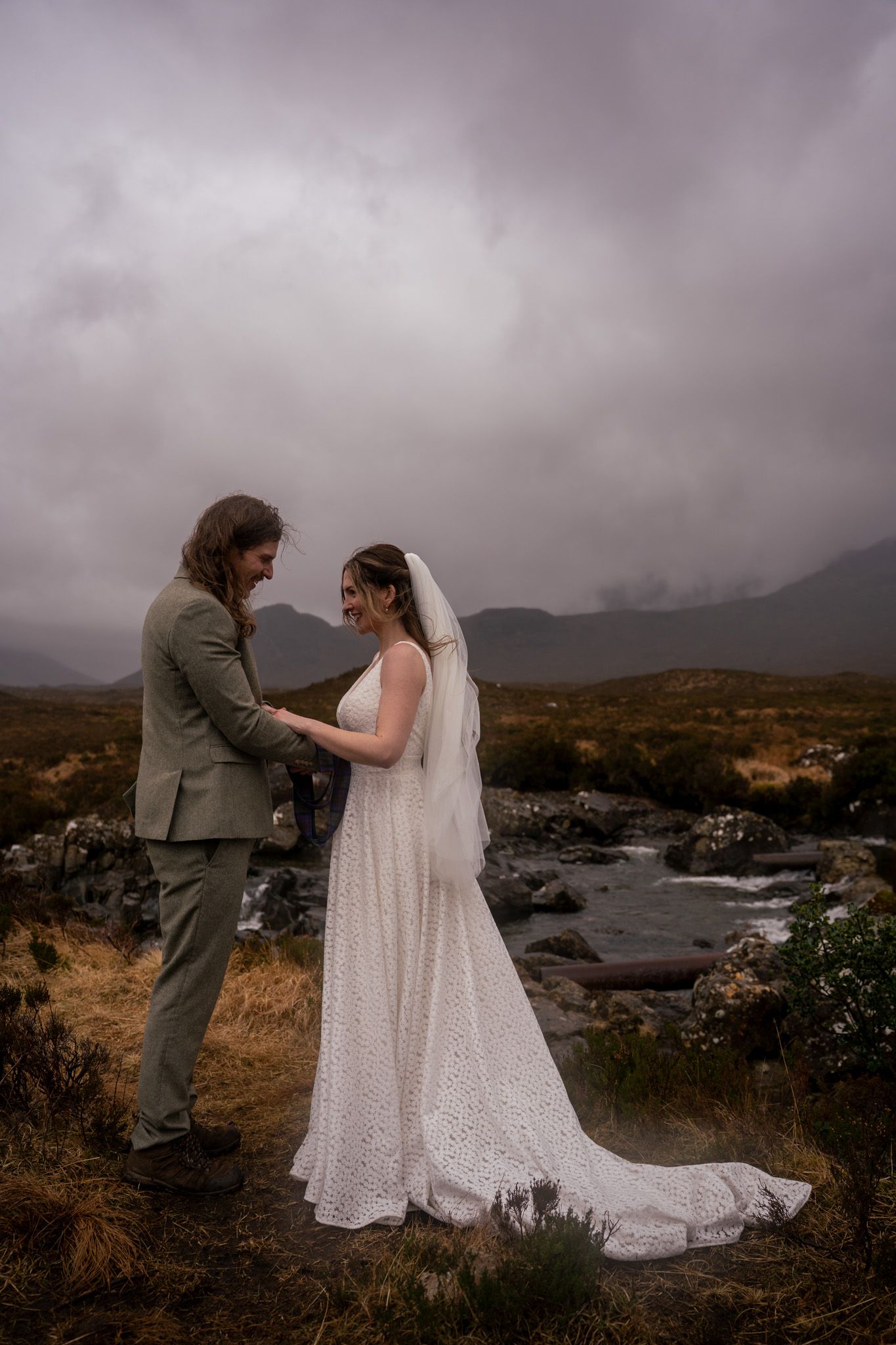 Bride and groom exchanging vows on the Isle of Skye, candid and romantic wedding photography in a natural, unposed style
