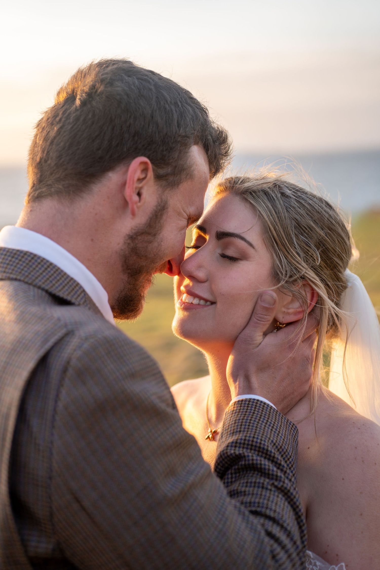 Golden Hour on the isle of skye, Bride and groom embracing at sunset on the Isle of Skye, Scotland, natural and romantic wedding photography