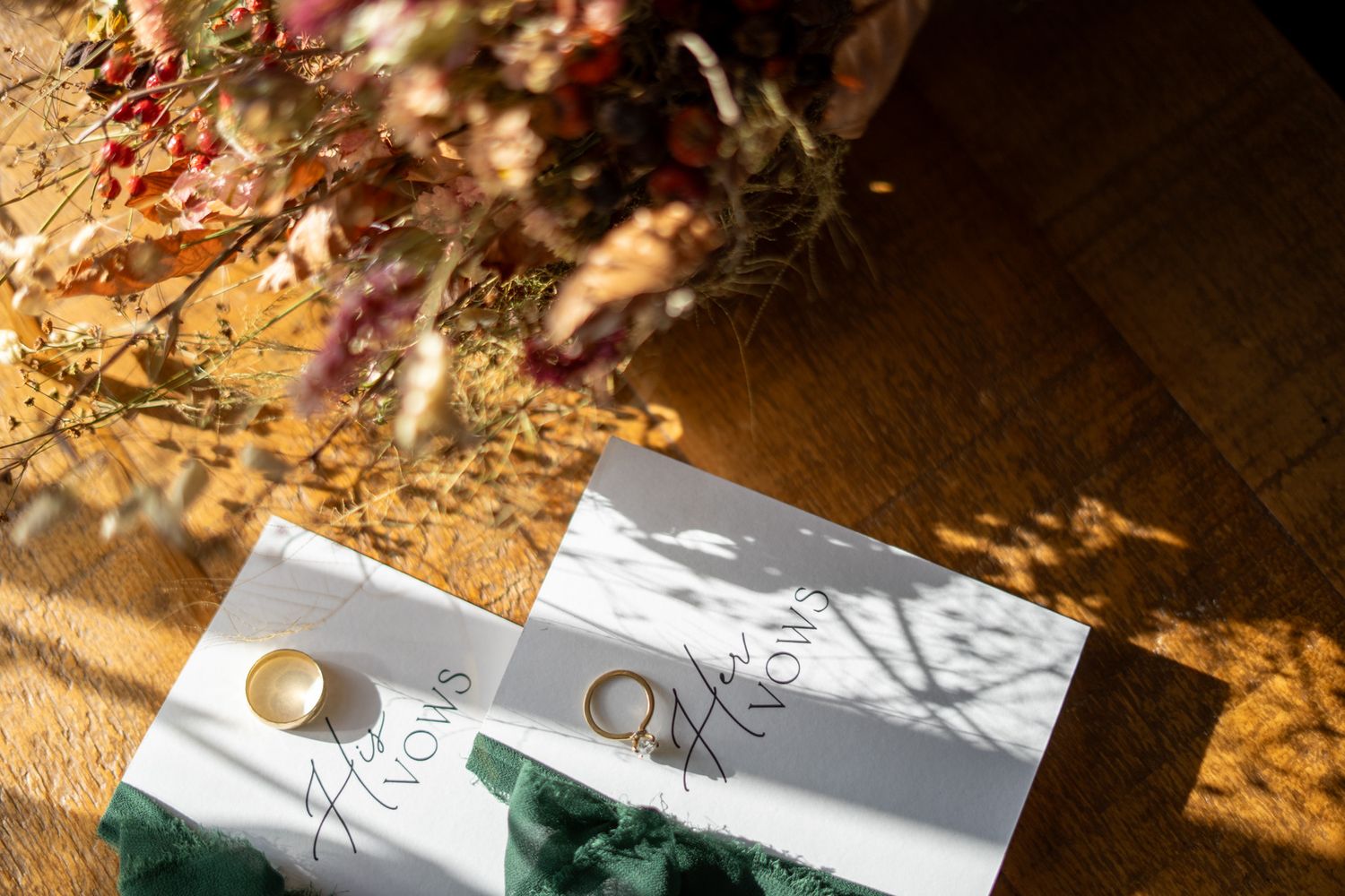 Detail shot of bride and groom’s vows and wedding rings, natural and romantic wedding photography capturing intimate moments