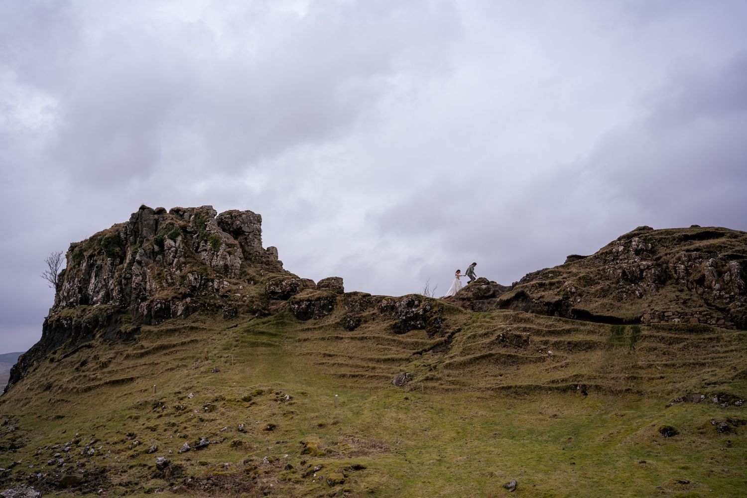 Couple walking together on the Isle of Skye, natural and romantic elopement photography capturing authentic love and emotion