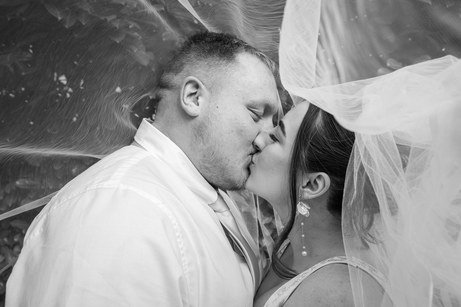 ride and groom at Airdrie registry office, romantic veil shot, natural and emotional wedding photography capturing authentic moments