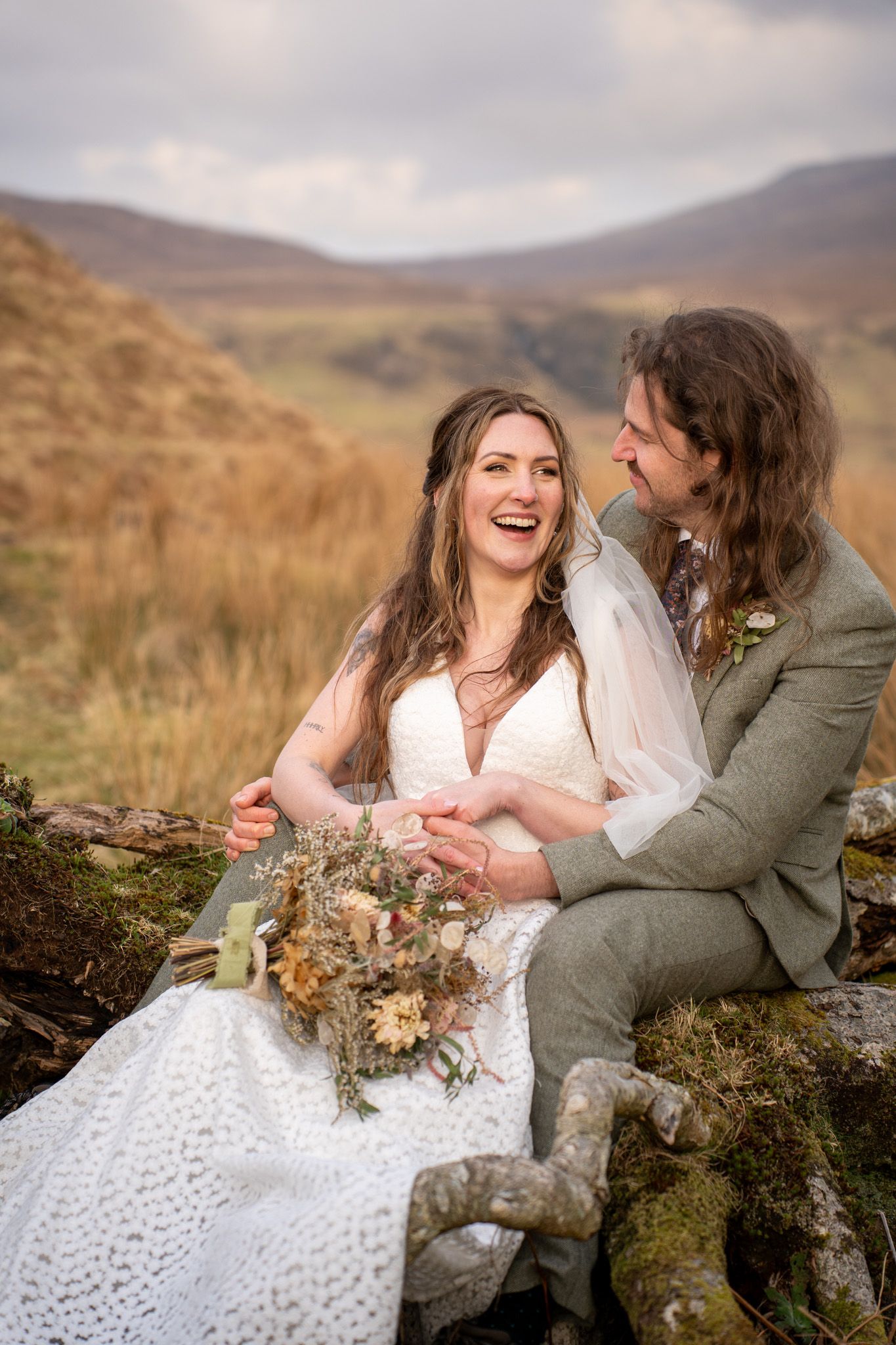 Bride laughing with groom at Isle of Skye, natural and candid wedding photography capturing authentic love, romance, and emotional moments.