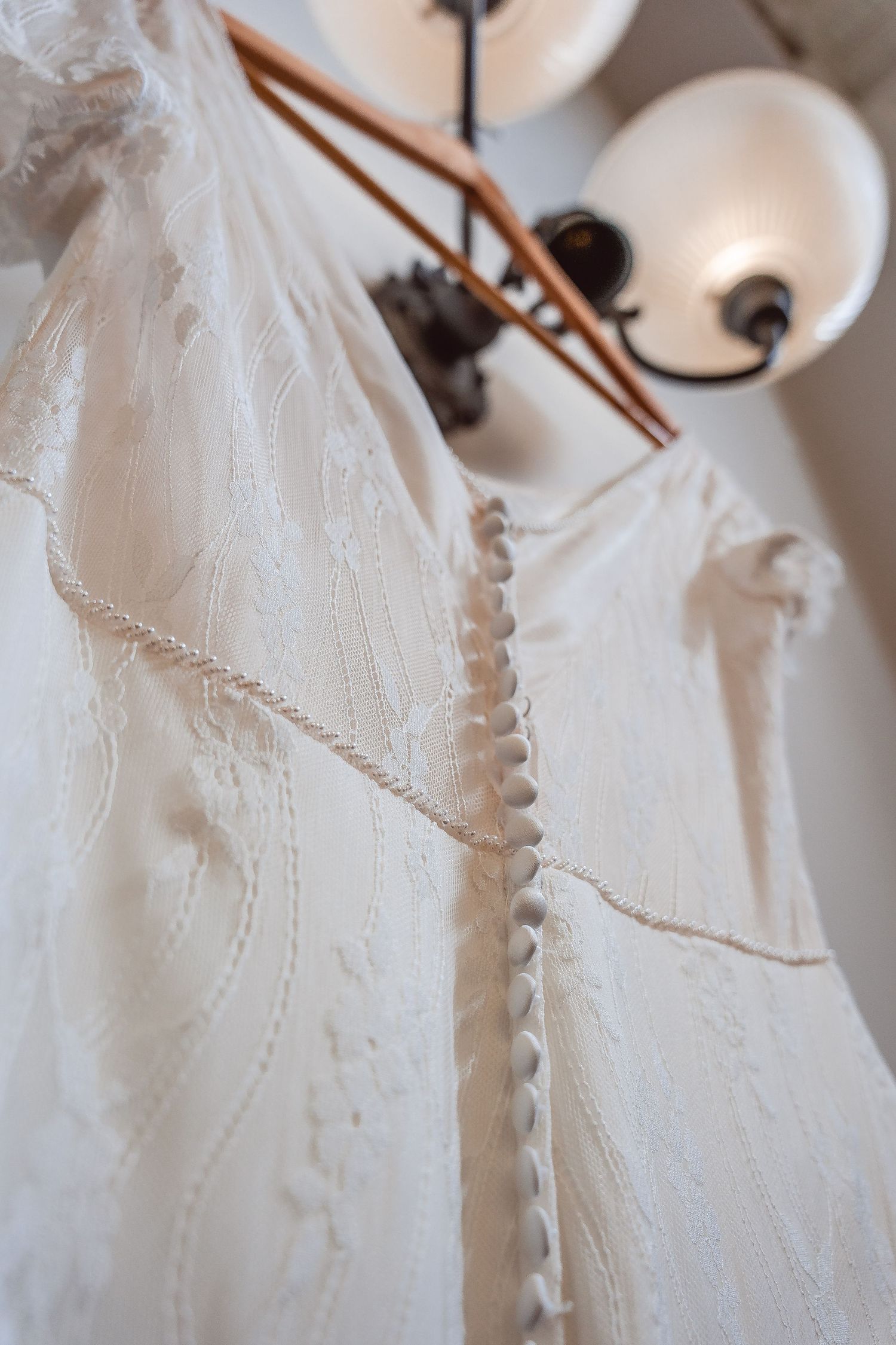 Details of buttons down the back of the dress