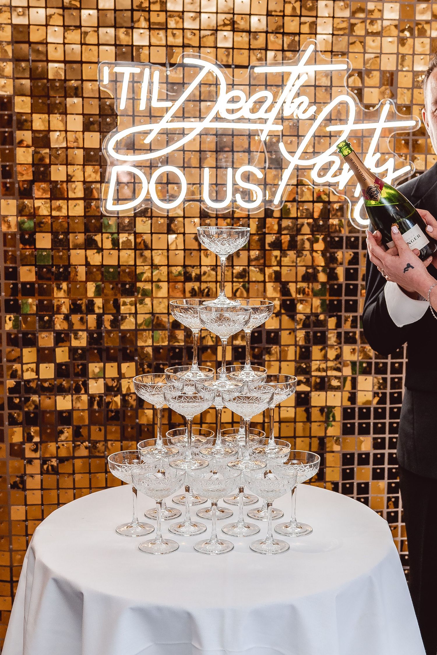 Champagne Tower with Gold sequin backdrop and 