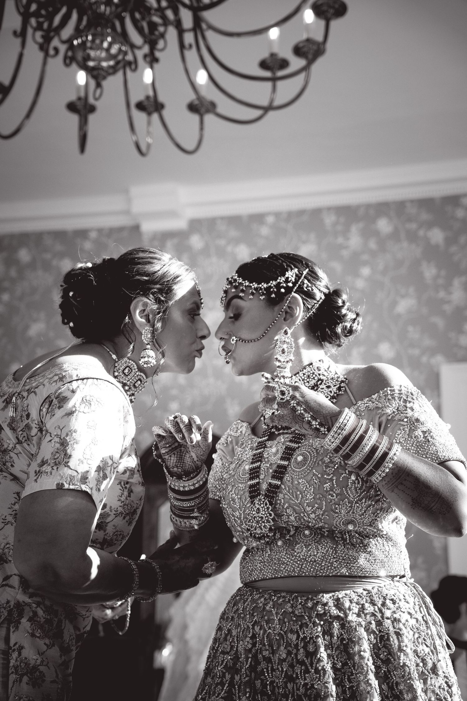 Black and White photo of bride and mum kissing and saying goodbye