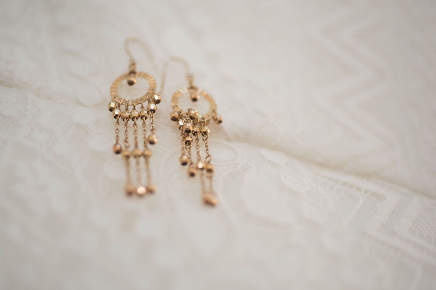 Gold earrings close up details