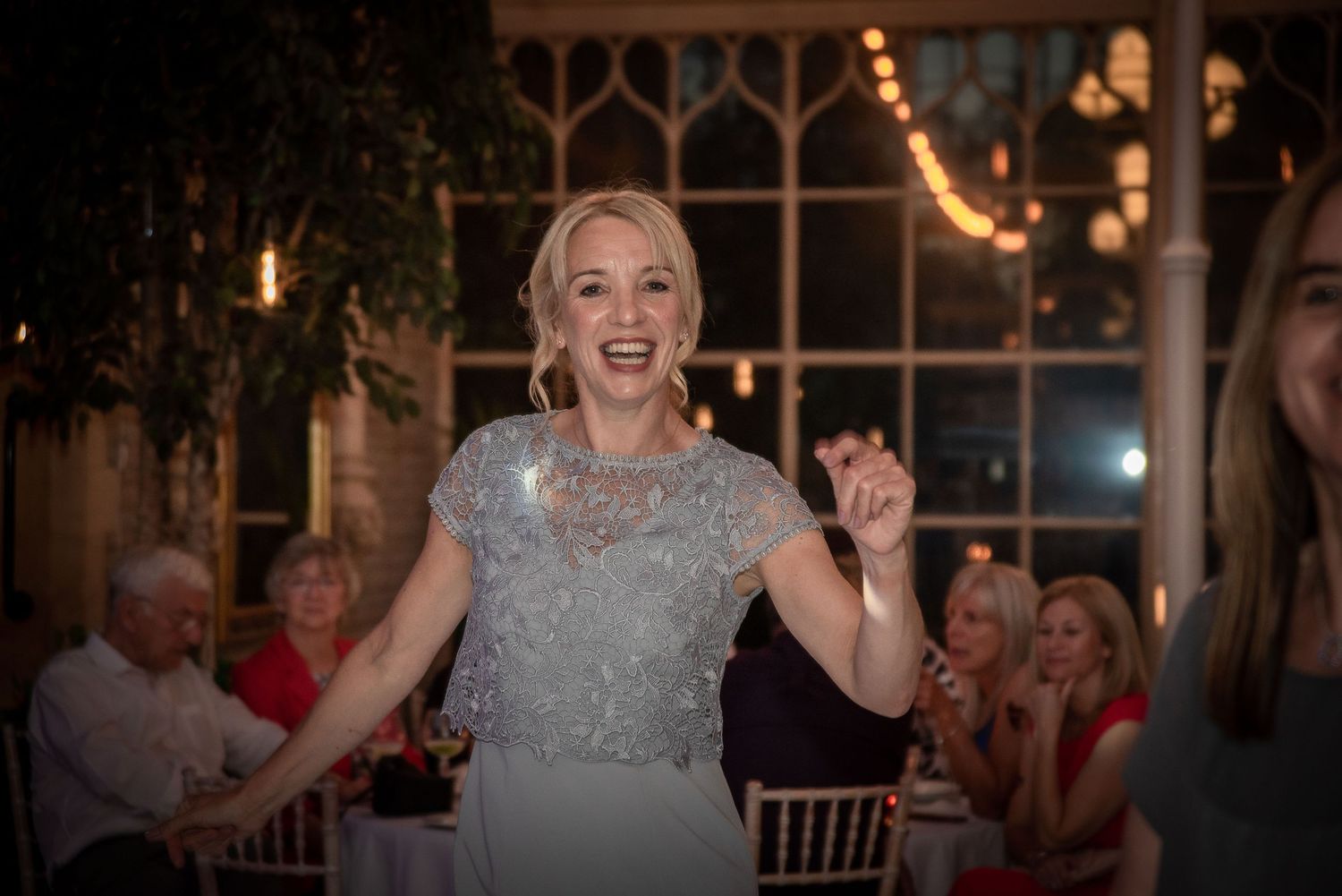 Wedding reception venue with warm lighting and festive atmosphere.
