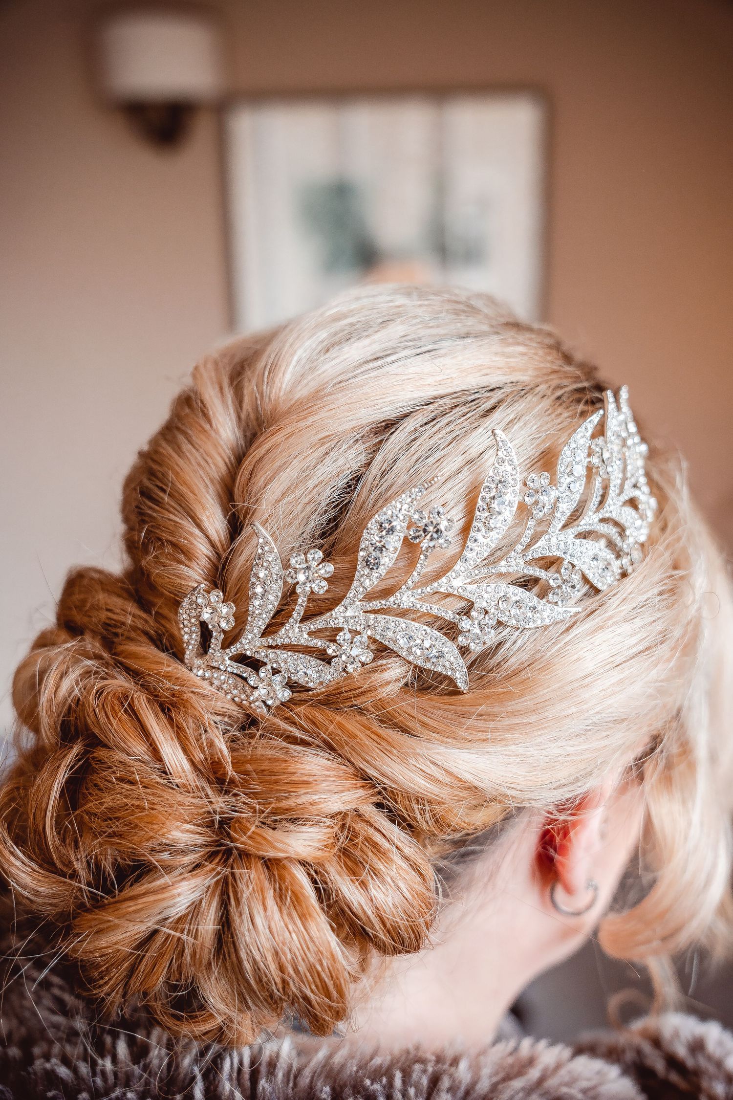 Detail shot of head piece with leaf design covered in small diamonds