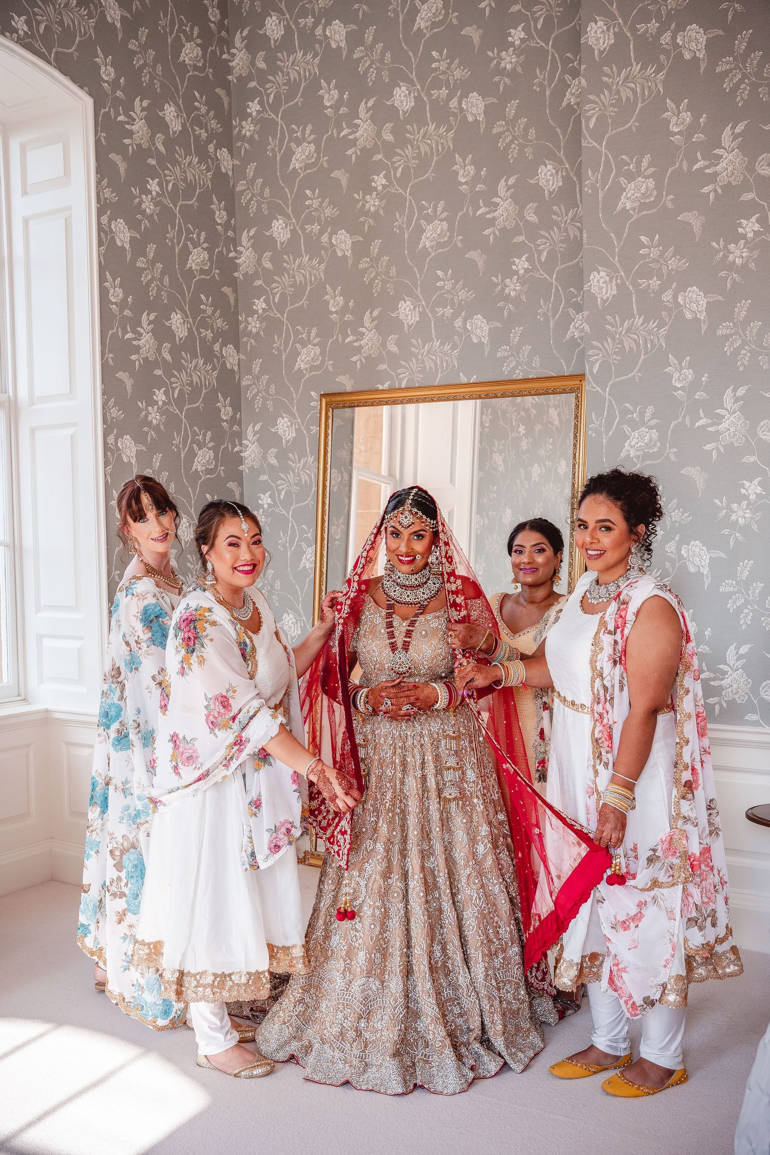 Portrait of Indian Sikh Bride with her Bridesmaids around her