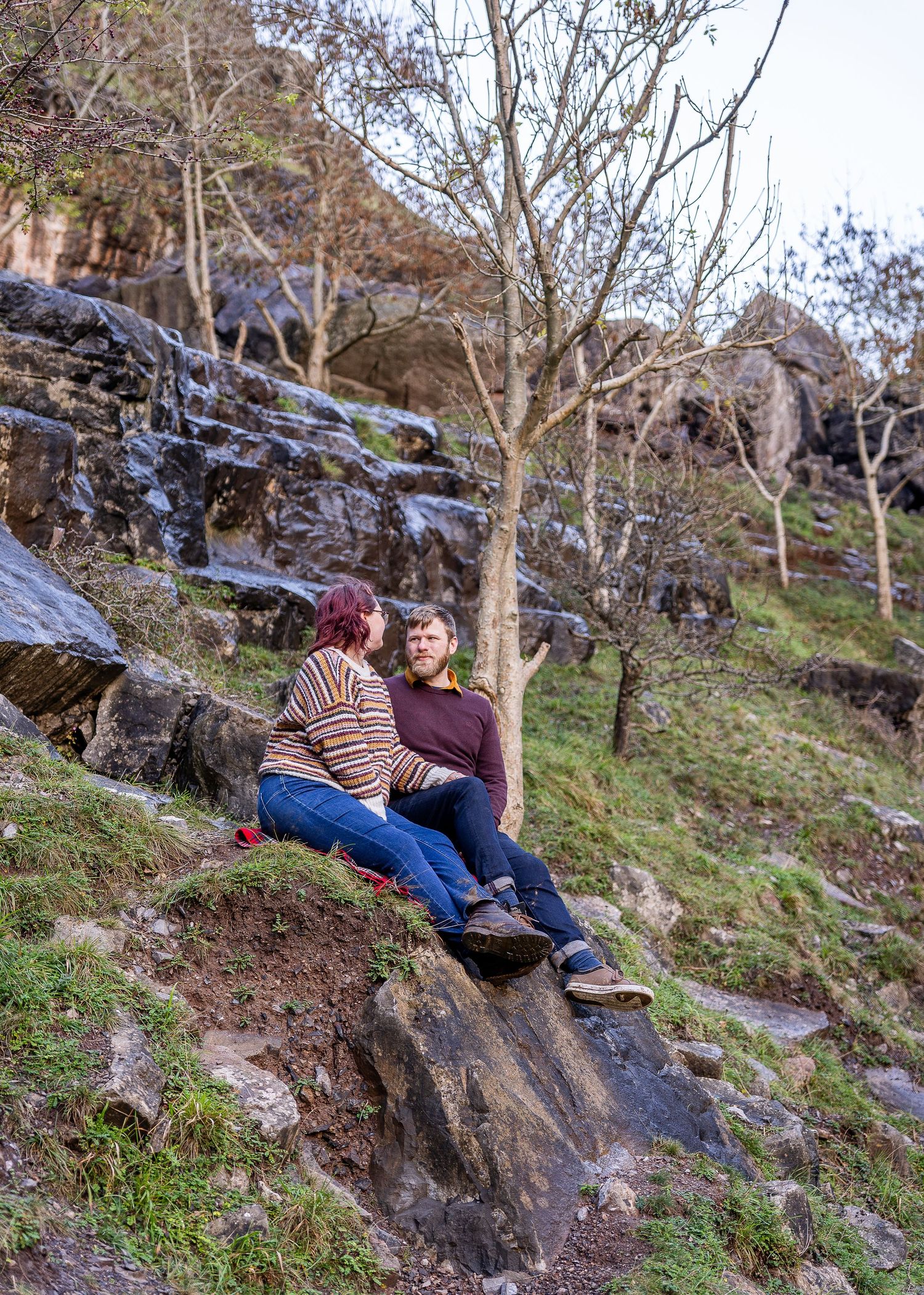 Couple sat on a boulder admiring the gorge and nature around them.