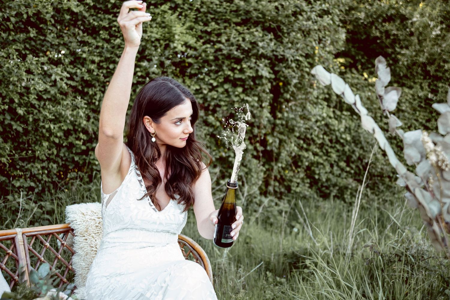 A romantic outdoor bridal portrait session featuring natural greenery and soft lighting.