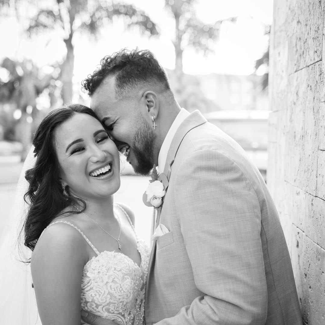 A romantic couple shares intimate moments in black and white wedding photos against a light background.