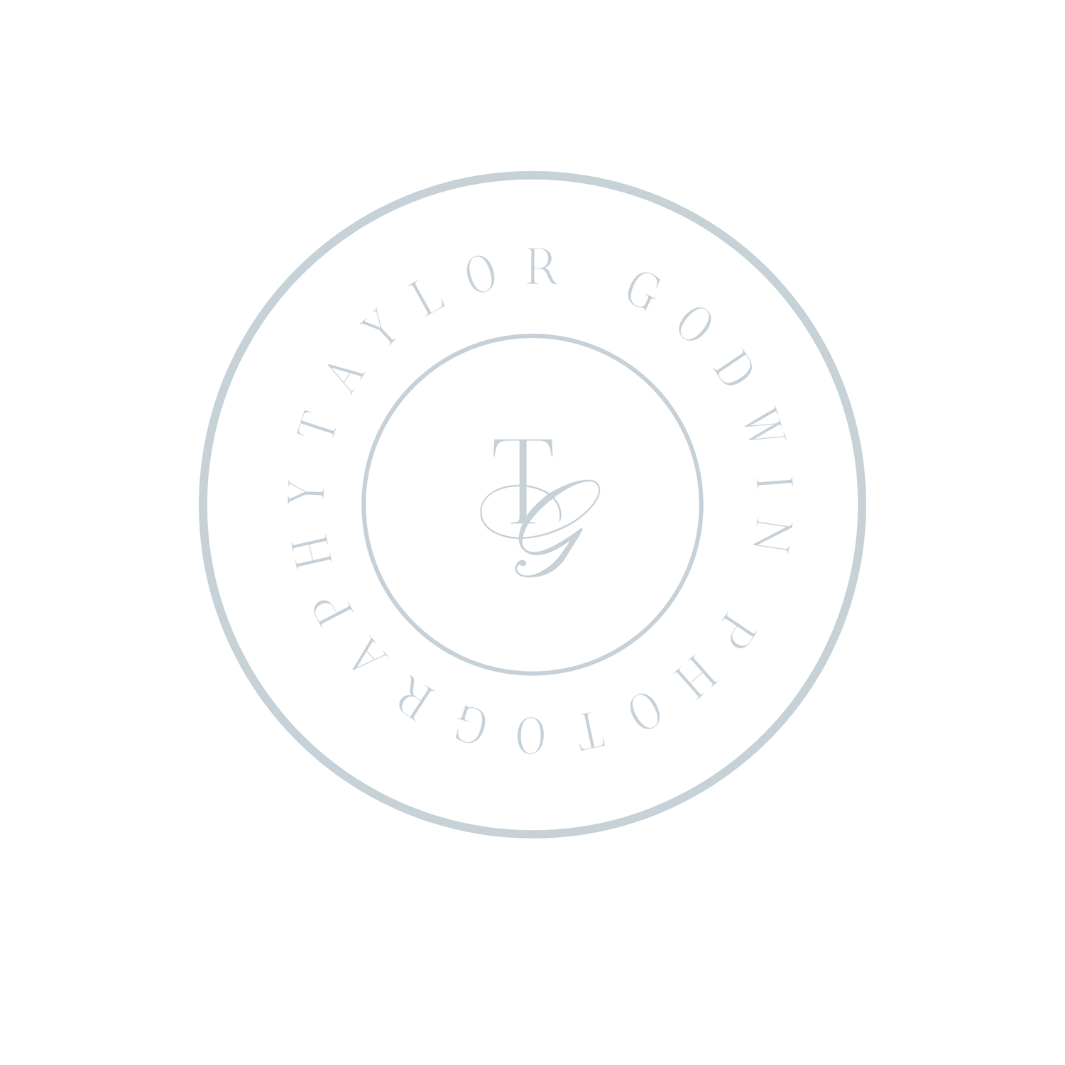 Light blue circular logo for Taylor Godwin Photography featuring elegant TG monogram initials in delicate serif font.