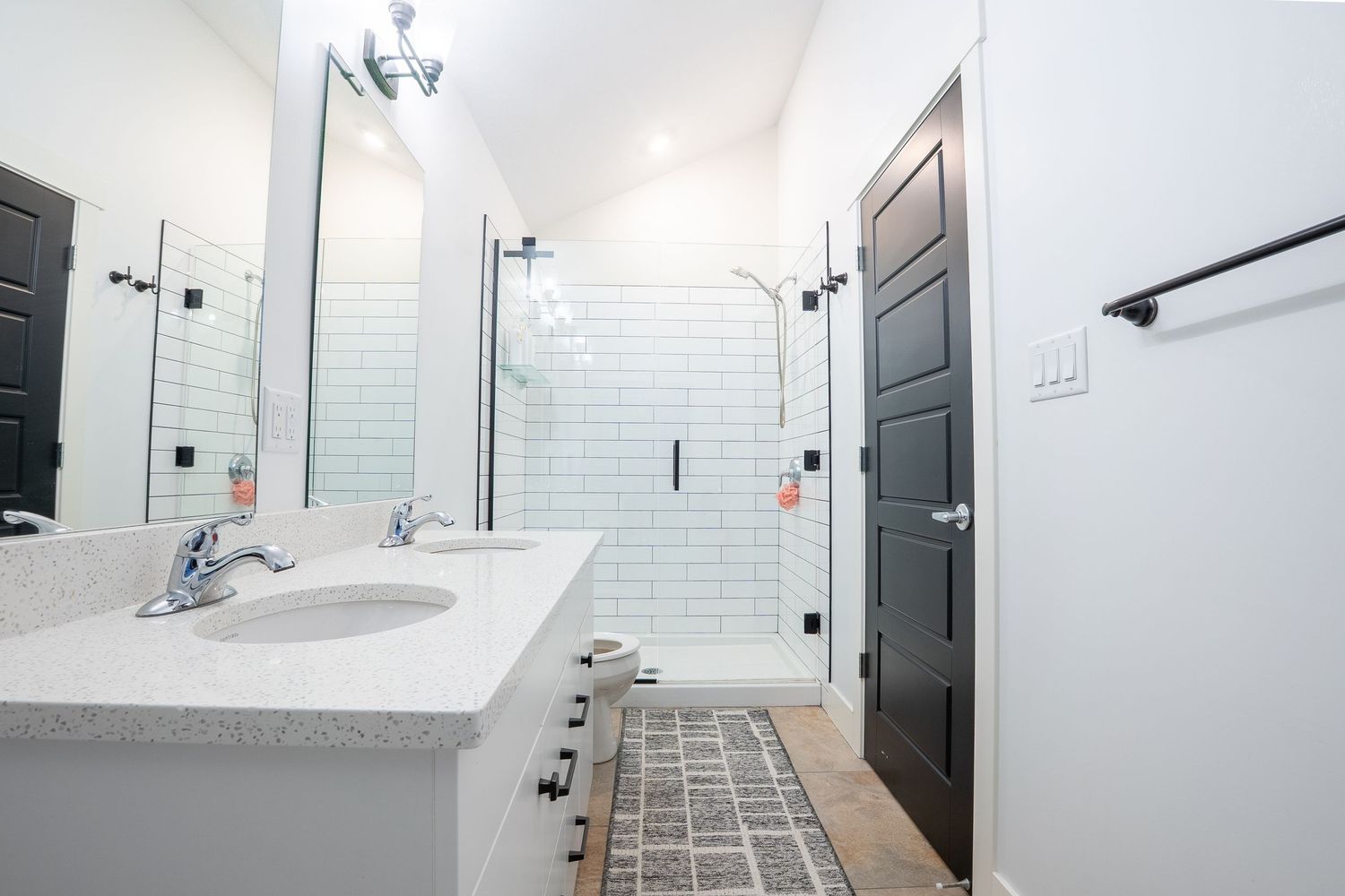 Bright white bathroom real estate photography in Saskatoon Saskatchewan highlighting clean design and fixtures.
