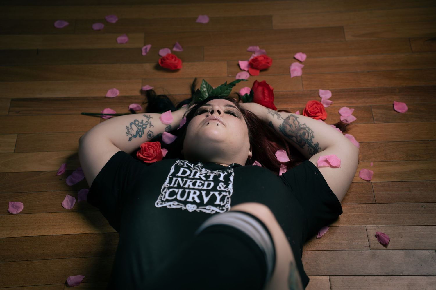 Boudoir photography portrait in Saskatoon Saskatchewan capturing relaxed pose and soft dramatic lighting.