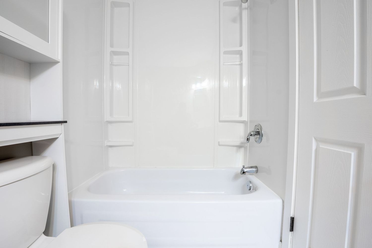 Bright white bathroom real estate photography in Saskatoon Saskatchewan highlighting clean design.