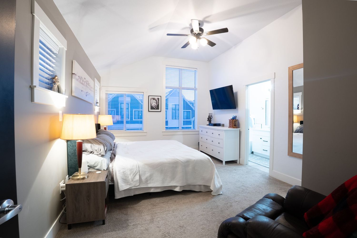 Spacious bedroom interior real estate photography in Saskatoon Saskatchewan highlighting natural light and clean layout.