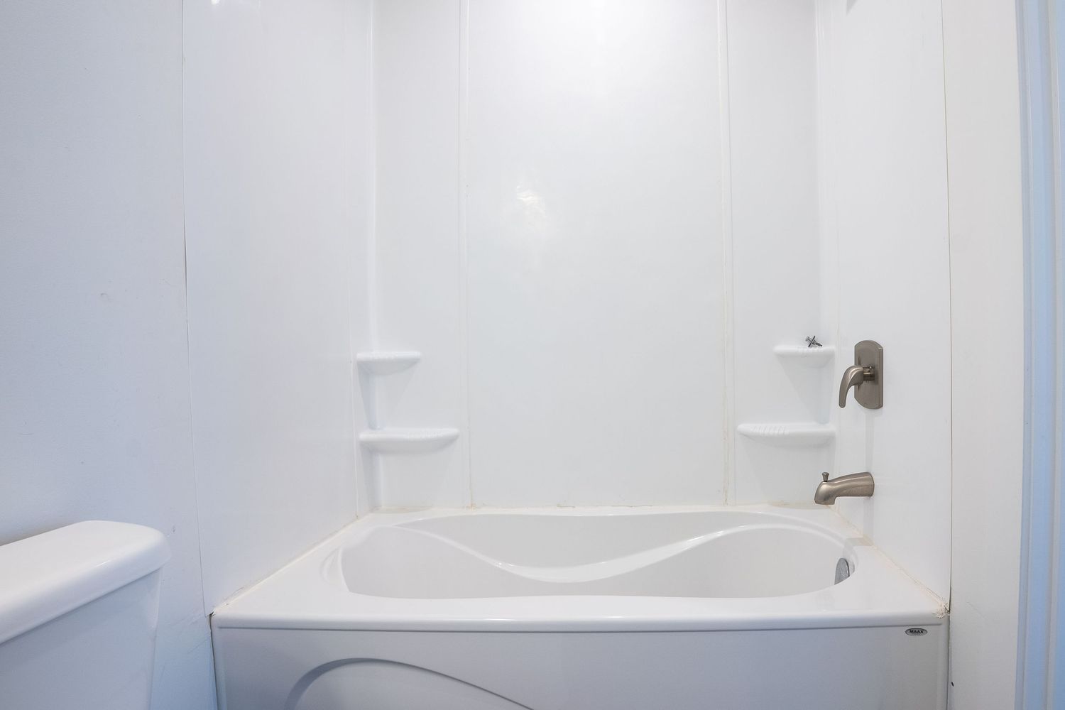 Modern bathroom with bathtub real estate photography in Saskatoon Saskatchewan showing clean bright interior.