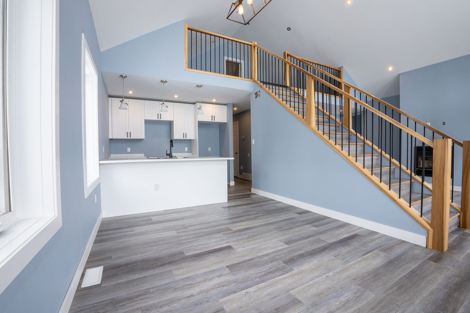 Kitchen with island real estate photography in Saskatoon Saskatchewan highlighting modern appliances and layout.